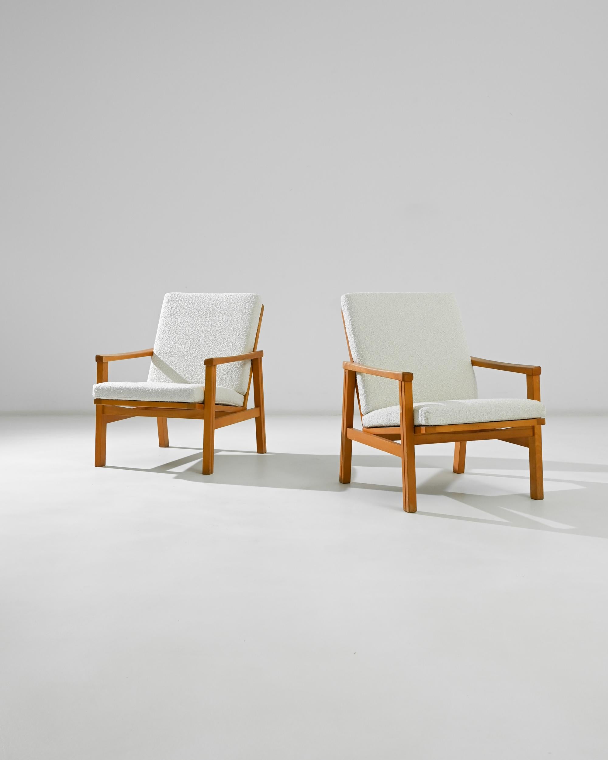 Introducing a pair of timeless elegance: these 1960s Czech Wooden Armchairs. Crafted with precision and care, each chair embodies the essence of mid-century design. The rich, warm tones of the wood exude sophistication, while the sleek lines and