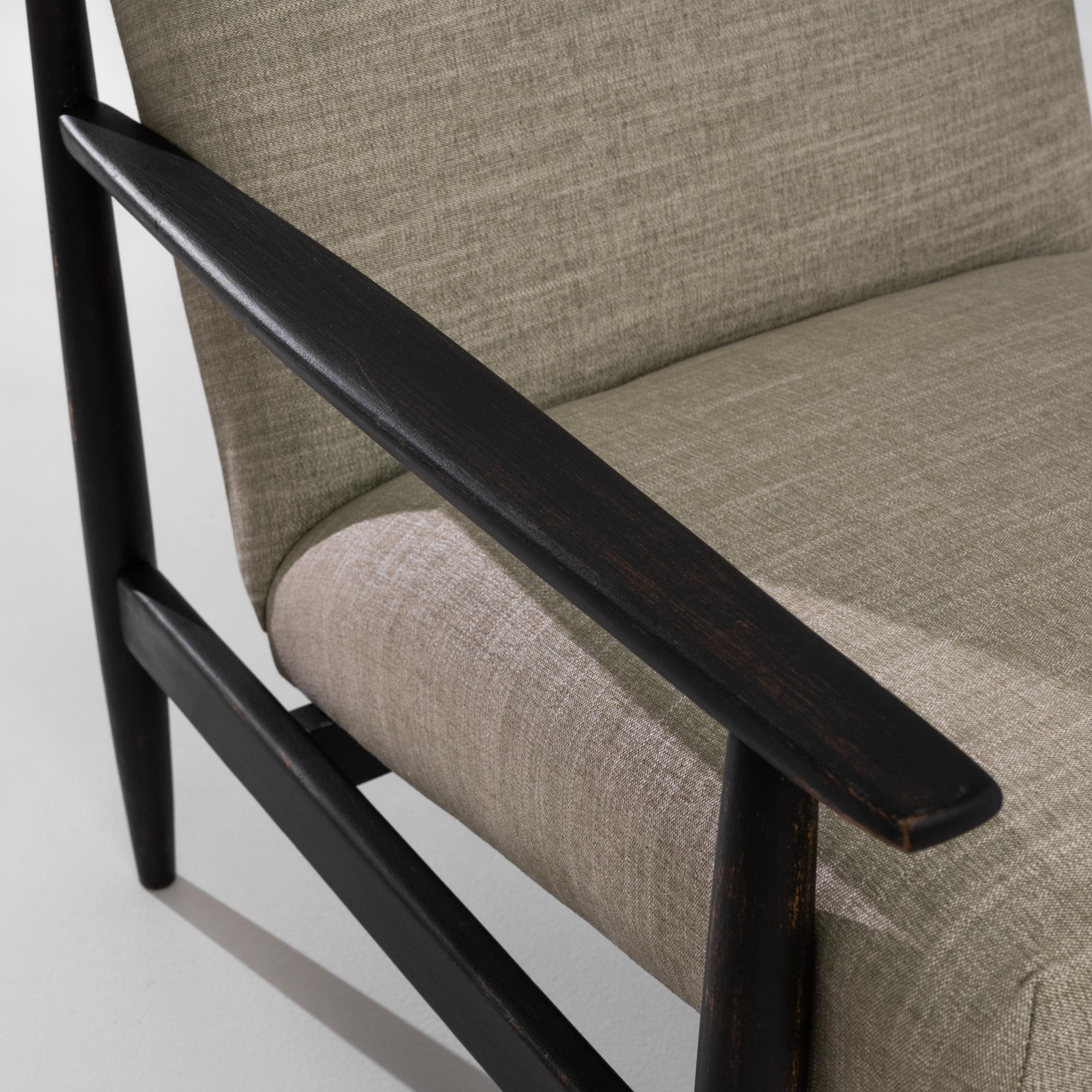 Light and sophisticated, this pair of vintage armchairs possess a unique Modernist silhouette. Made in the former Czechoslovakia in the 1960s, the reclined angle of the floating seat creates a comfortable counterpoint to the clean lines of the