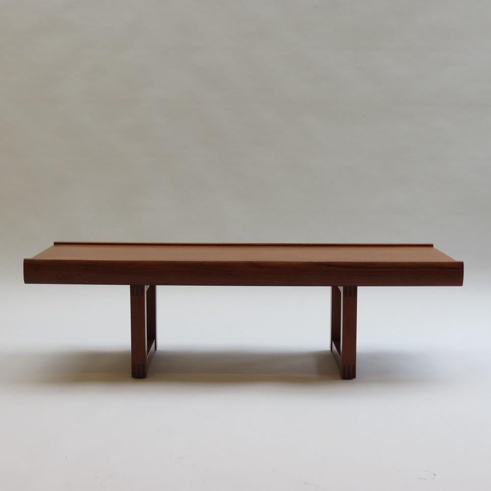 1960s Teak  bench or coffee table designed by Malcolm Walker for Dalescraft, UK.  Wonderful quality, good heavy solid piece, vastly superior to the Norwegian Bruskbo Bench  Teak veneered top with solid Teak legs, solid Teak edges to the top and