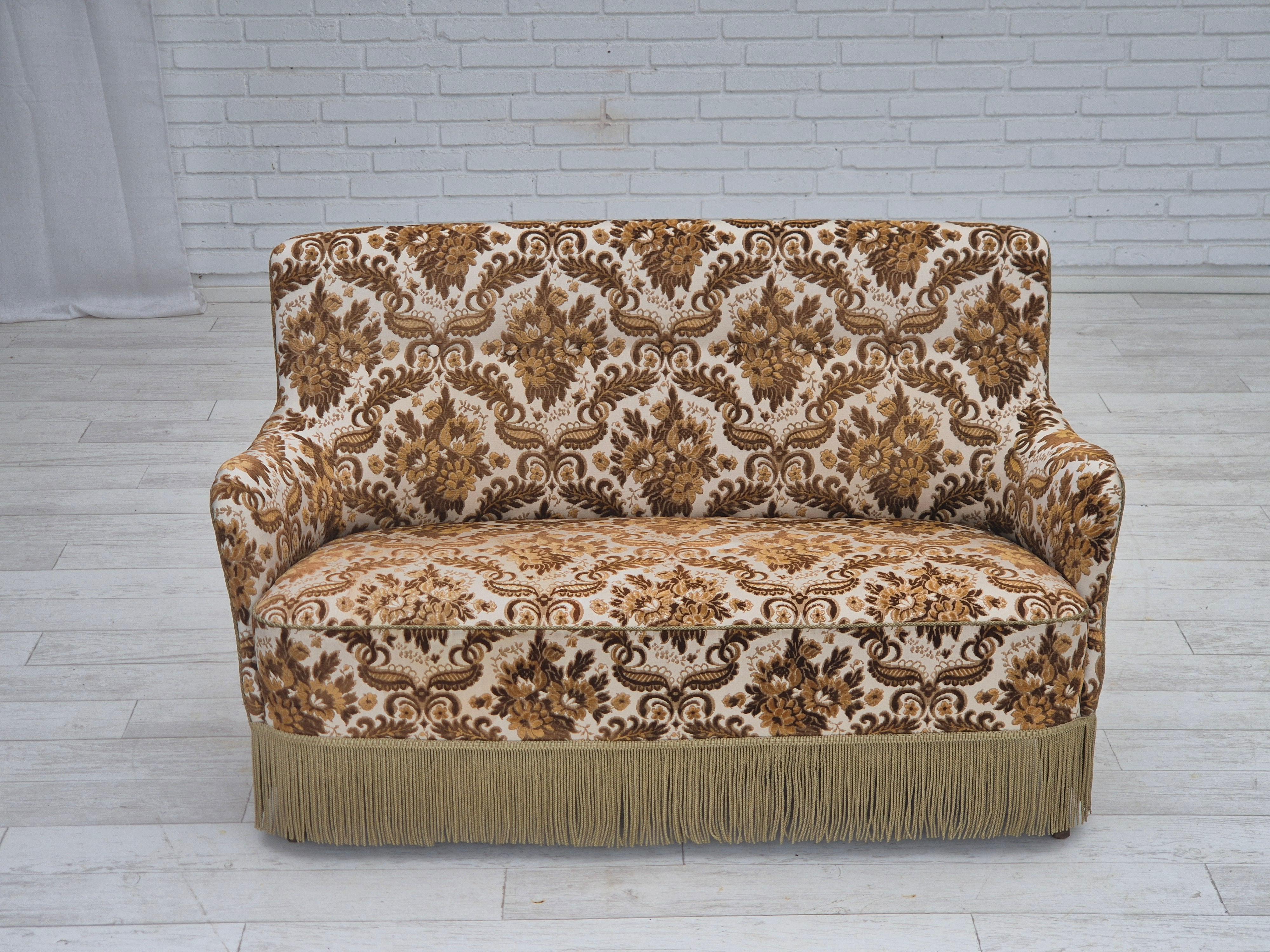 1960s, Danish 2-seater sofa. Brown/beige furniture fabric, ash wood legs, brass springs in the seat. Sofa was reupholstered by craftsman about 15 years ago. Very good condition: no smells, no stains and stable construction. Manufactured by Danish