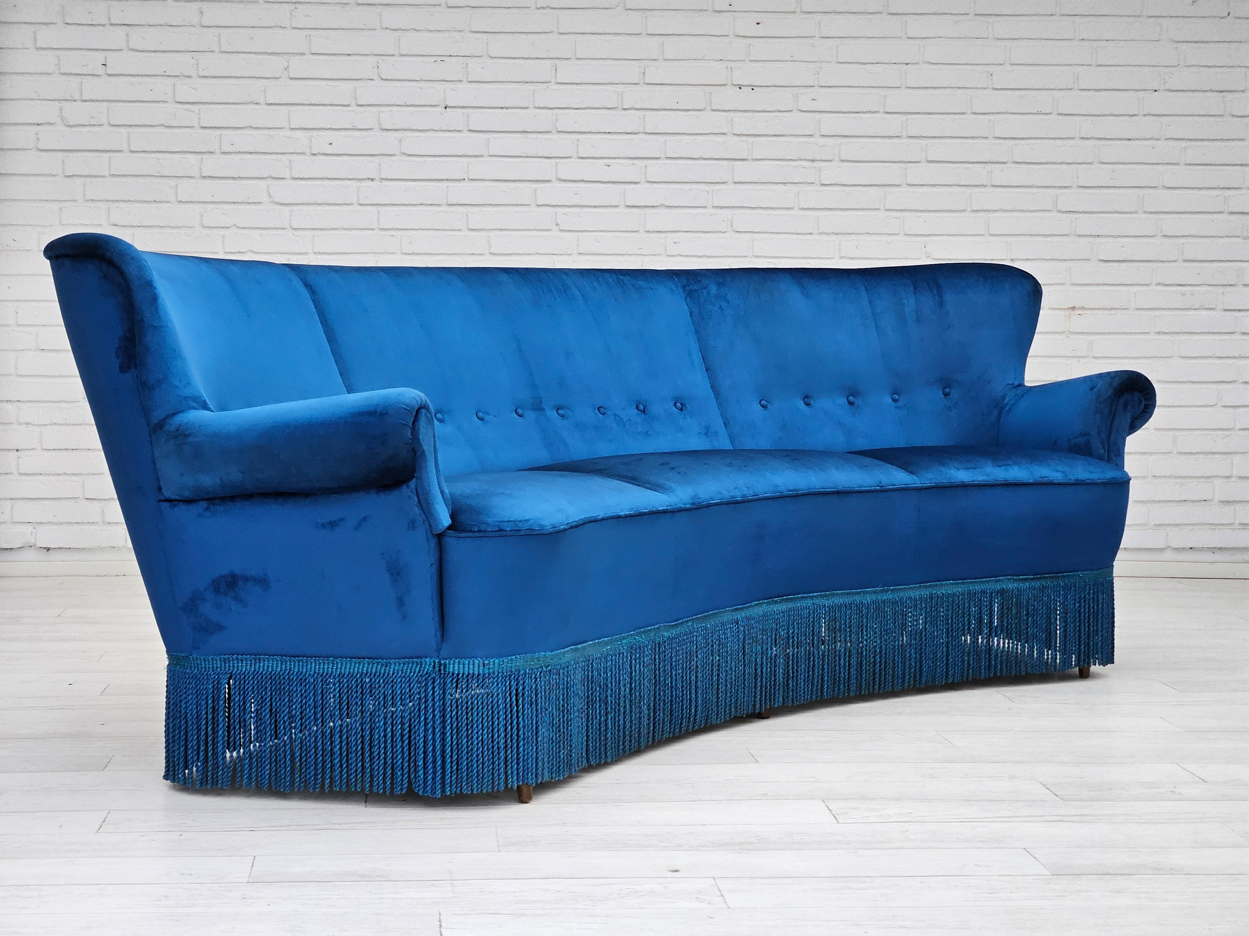 1960s, Danish 3-seater curved sofa. Blue furniture velour, beech wood legs, brass springs in the seat. Sofa was reupholstered about 10 years ago by craftsman. Manufactured by Danish furniture maker in about 1960-65s. Original Scandinavian vintage