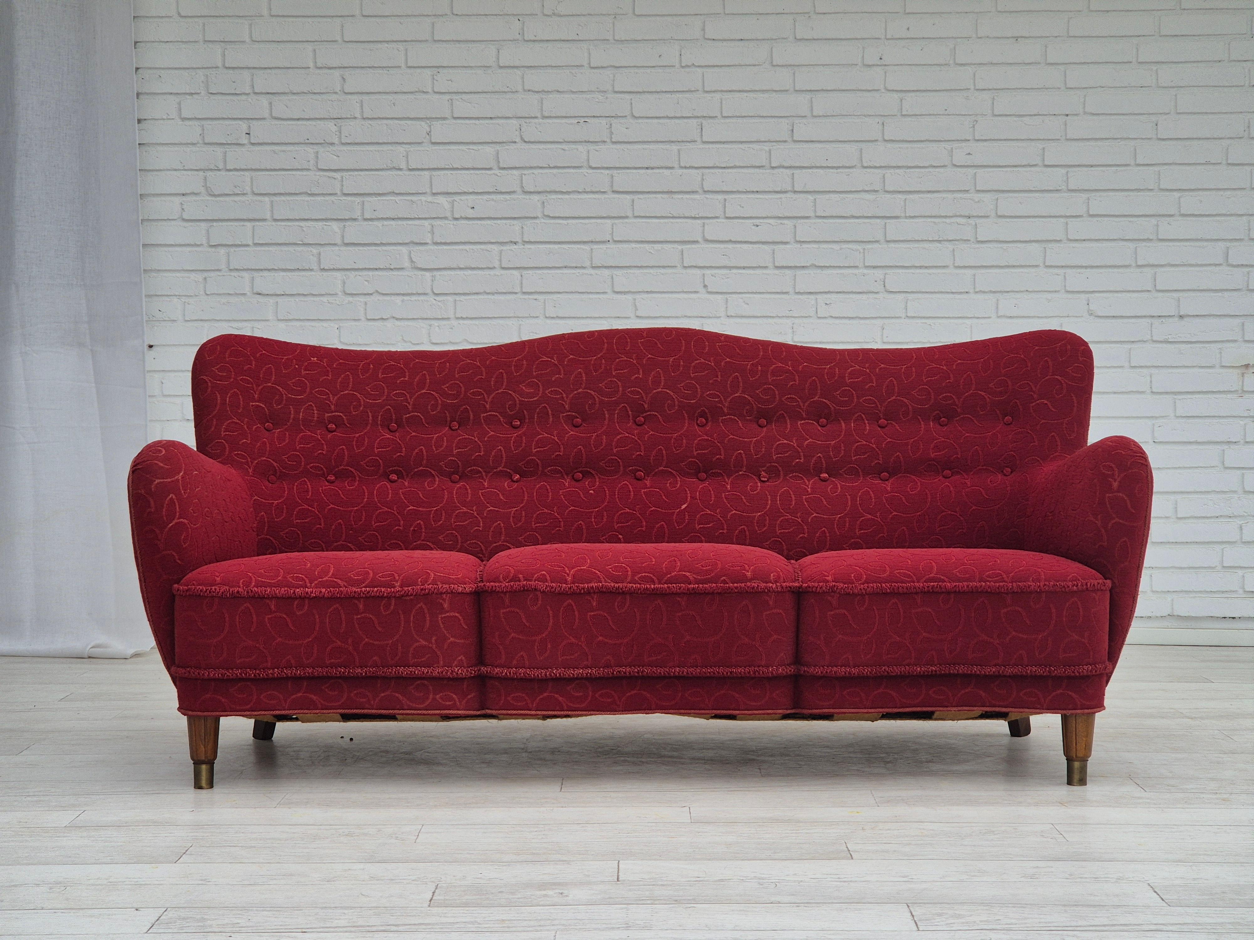 1960s, Danish 3 seater sofa in original very good condition: no smells and no stains. Original red cotton-wool furniture fabric. Beech wood legs with brass plugs. Brass springs in the seat. Manufactured by Danish furniture manufacturer in about