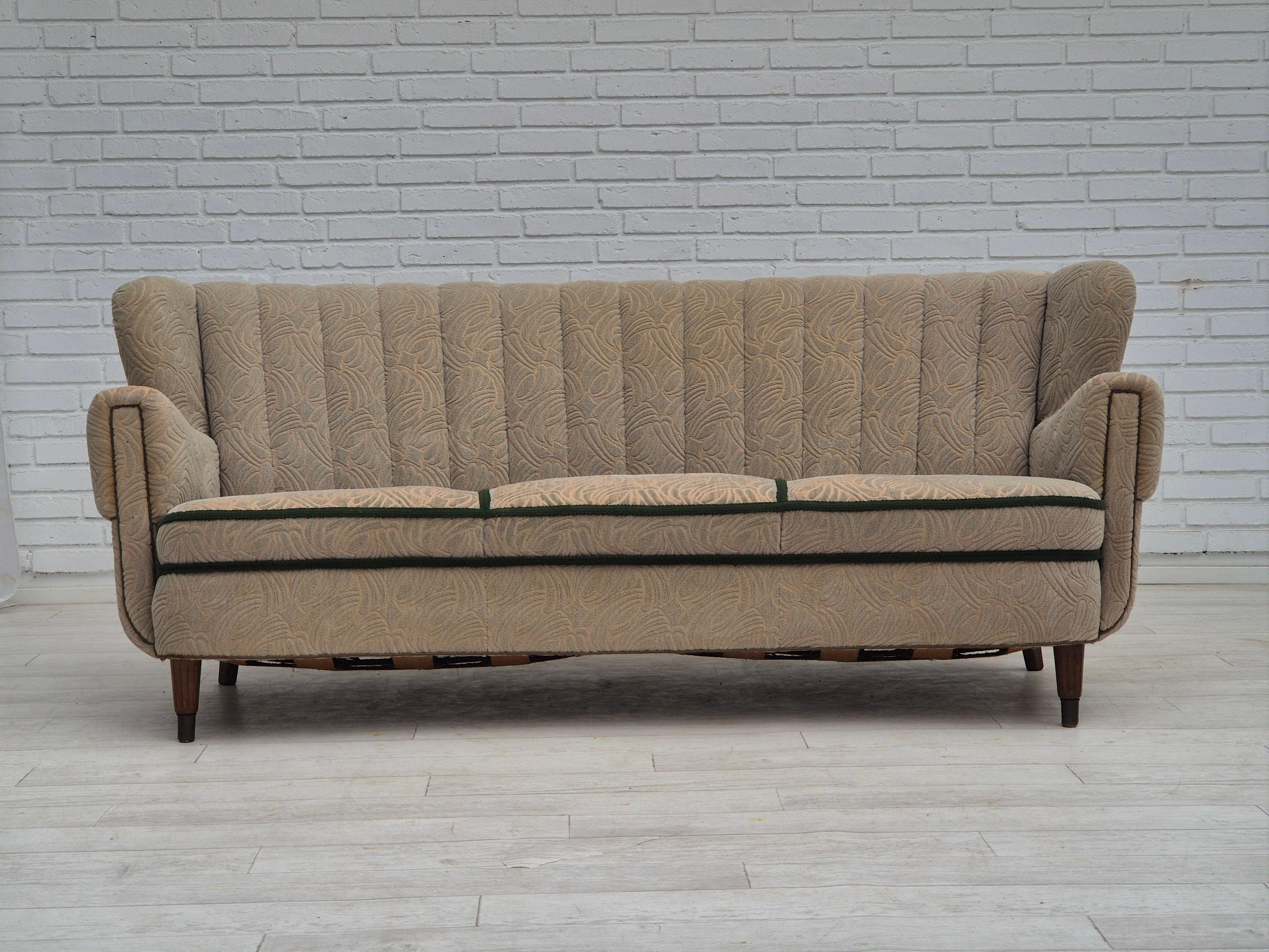 1960s, Danish 3 seater sofa in original good condition: no smells, no stains, stable construction. Slightly worn fabric surface on the front of the armrest. Sofa checked by craftsman. Original beige cotton/wool furniture fabric. Beech wood legs with