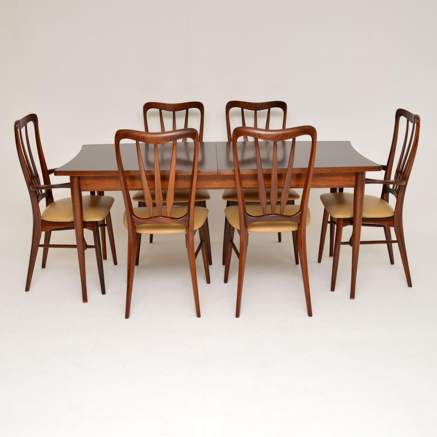 An absolutely stunning and extremely well made set of vintage Danish dining chairs in afromosia wood, these were designed by Nils Kofoed, they were made in Denmark in the 1960s. This model is called the “Ingrid” chair, and they have a beautiful