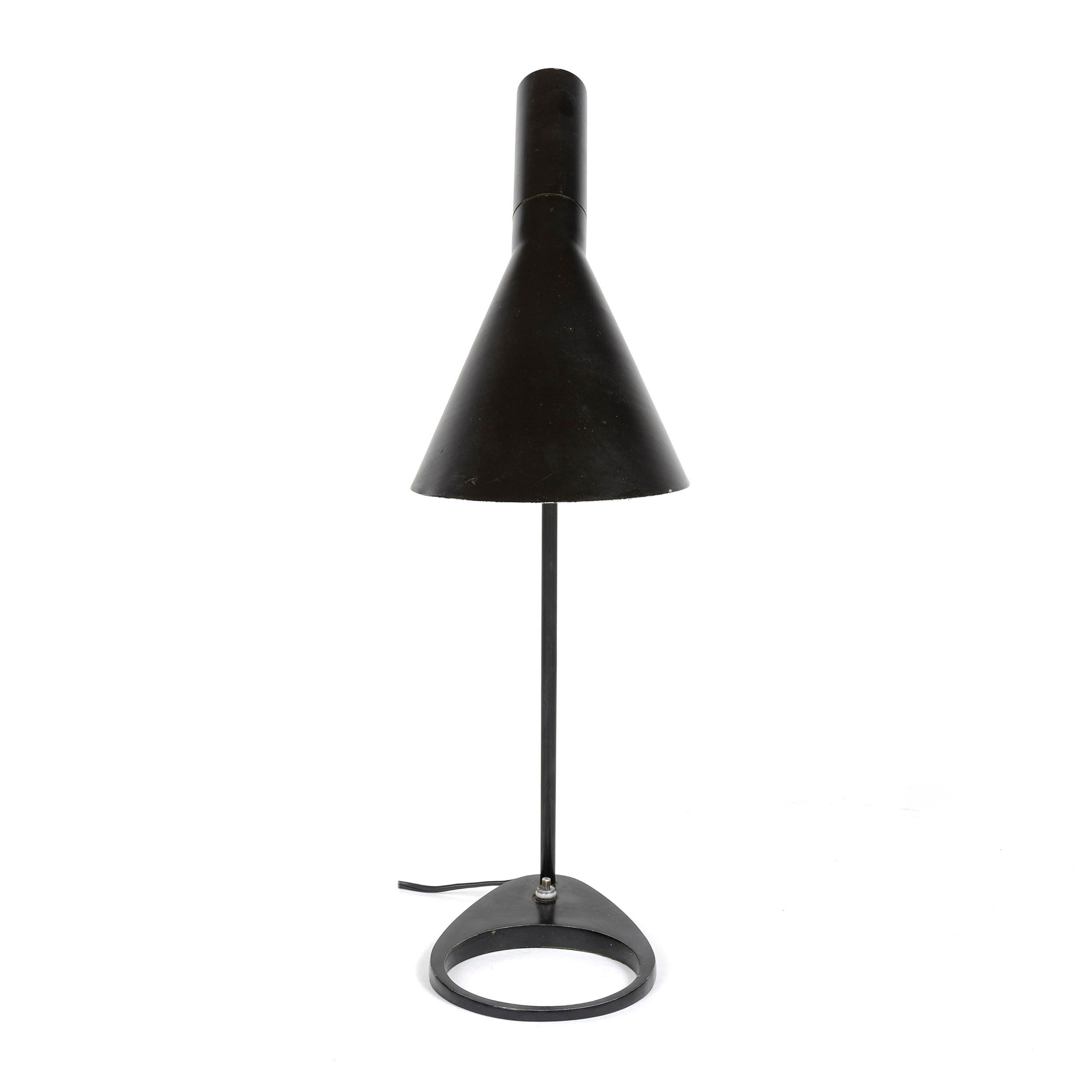 A painted metal desk lamp, having a pivoting 'offset funnel' shade floating above a pierced egg-form base.