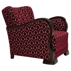 Anni 
60, poltrona Wood, velluto rosso ciliegia, legno di quercia.