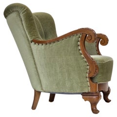 Años 60, sillón danés, muebles de terciopelo verde, madera de roble tallada.