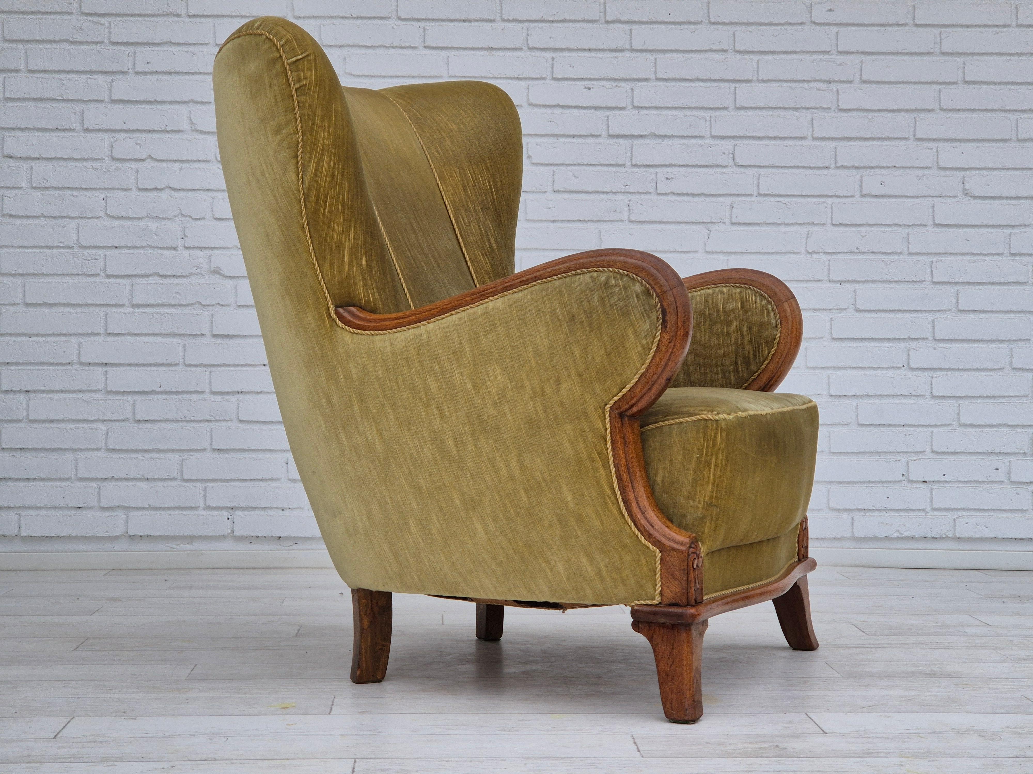 1960s, Danish armchair in original very good condition: no smells and no stains. Light green furniture velour, oak wood. Brass springs in the seat. Manufactured by Danish furniture manufacturer in about 1960s.