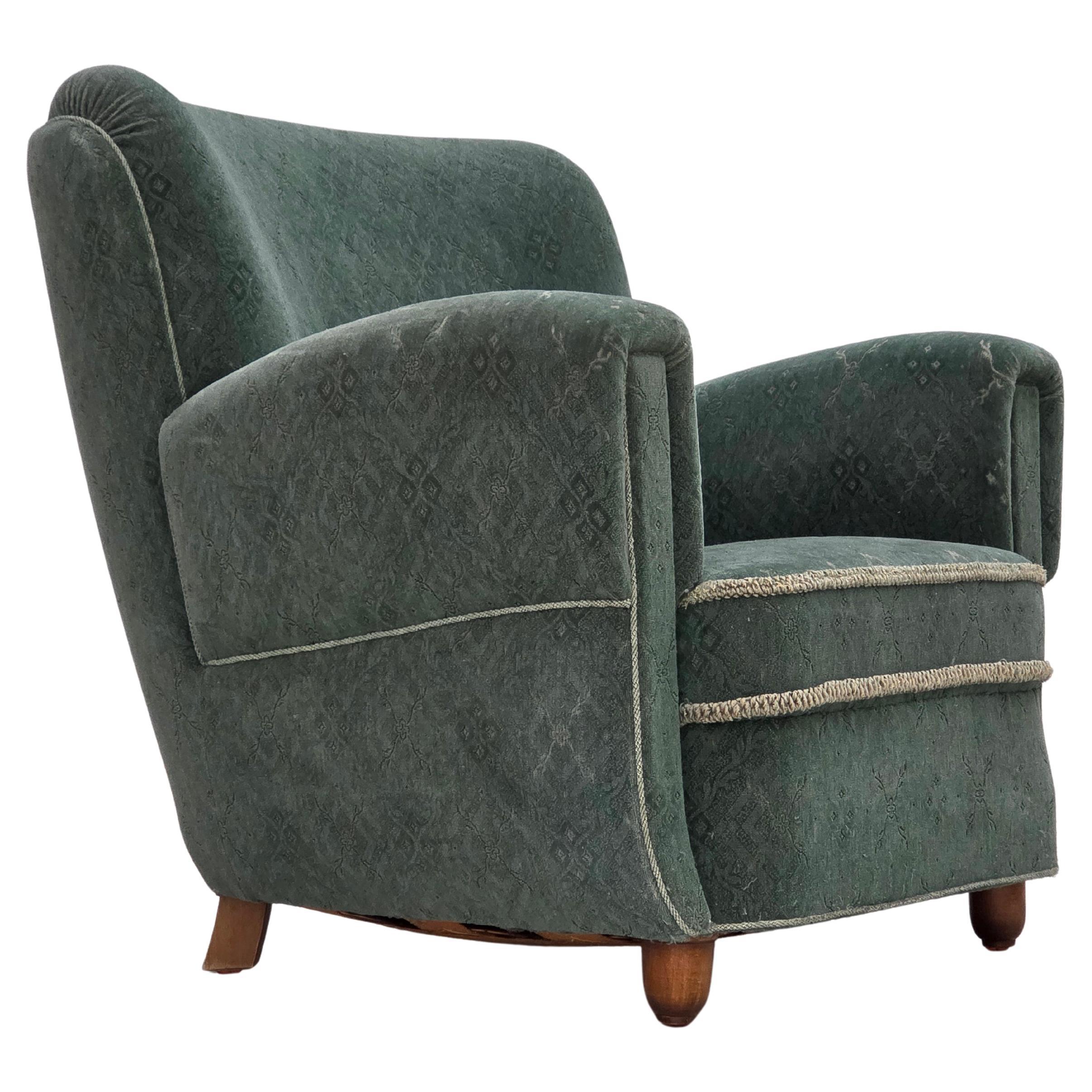 Años 60, sillón danés, muebles de lana verde claro, patas de madera de roble. en venta