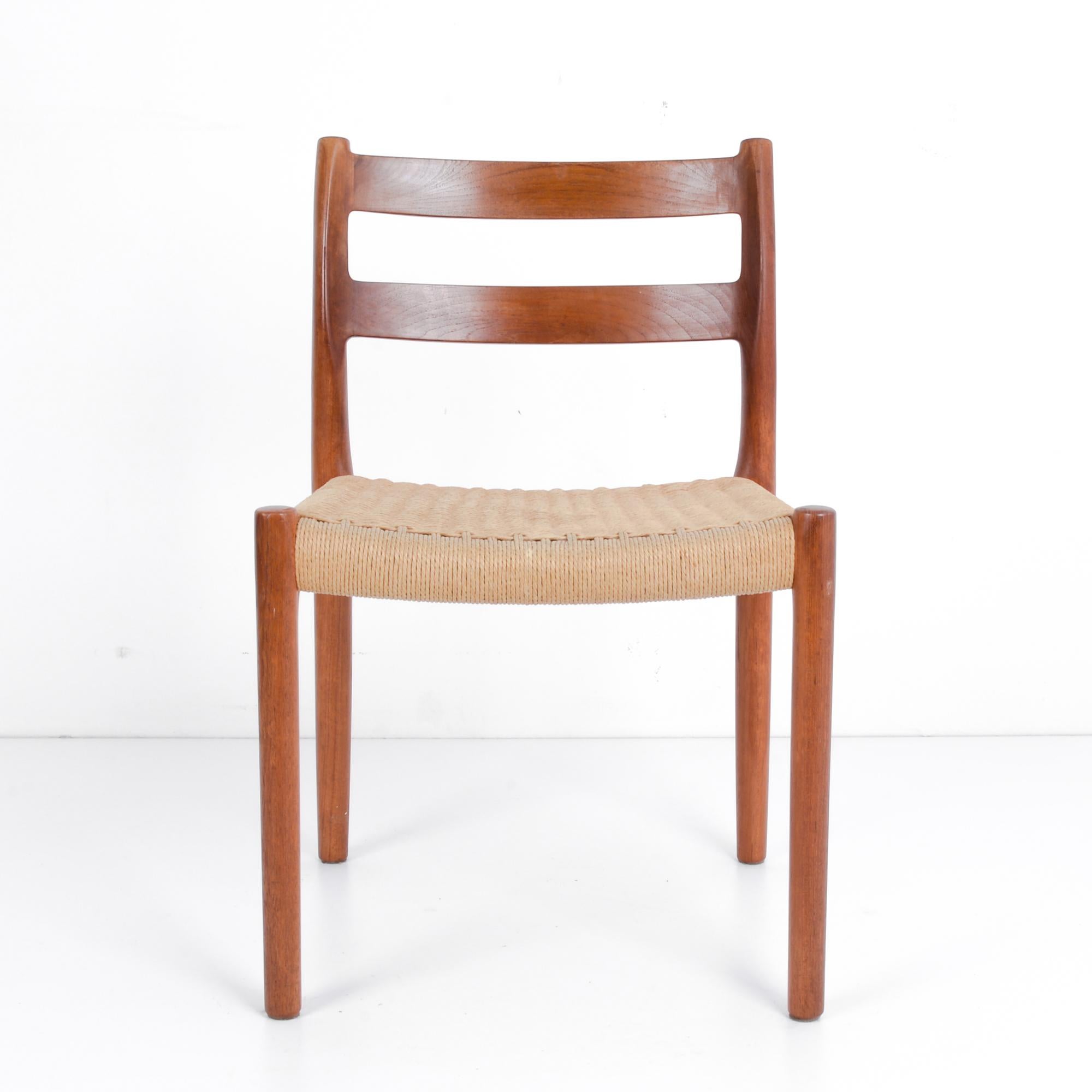 A vintage teak chair from celebrated Danish furniture designer Arne Hovmand-Olsen, produced in Denmark circa 1960. Well-known for his designs in the Scandinavian Modern Style, Hovmand-Olsen’s pieces are characterized by the vitality of their curves