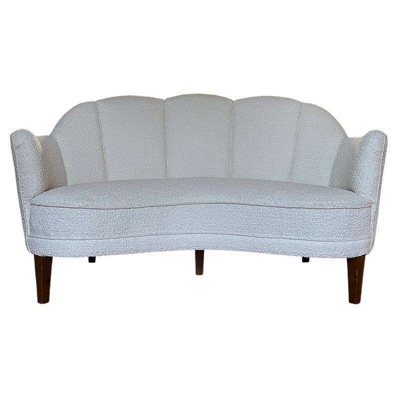 1960s Danish Banana two seater sofa with scalloped back in cream boucle. im Angebot