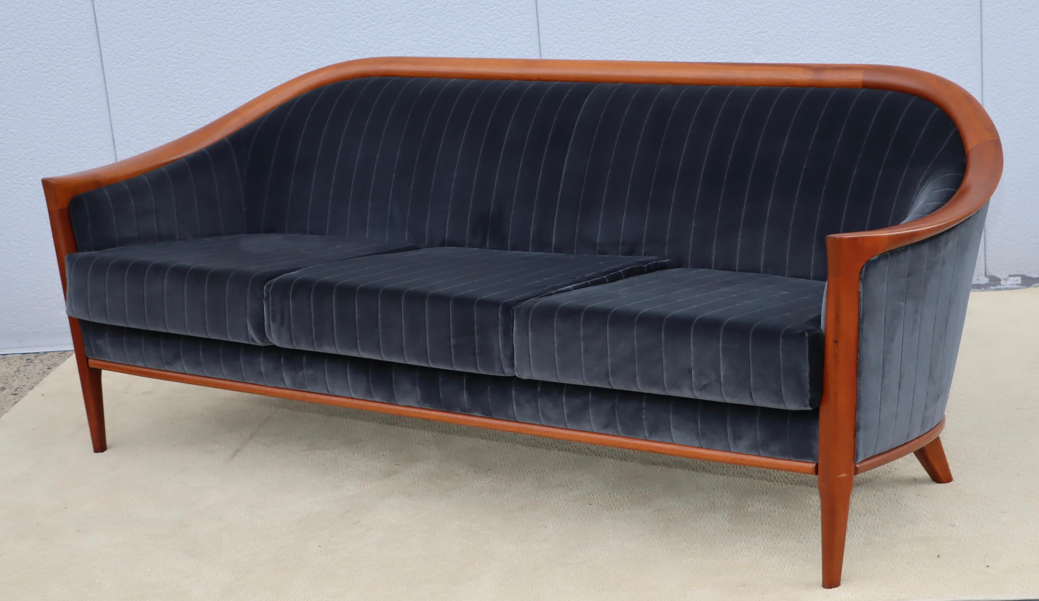 1960's mid-century modern Bertil Fridhagen teak and velvet upholstery sofa, fully restored and re-upholstered in Kravet velvet with some wear to the teak due to age and use.