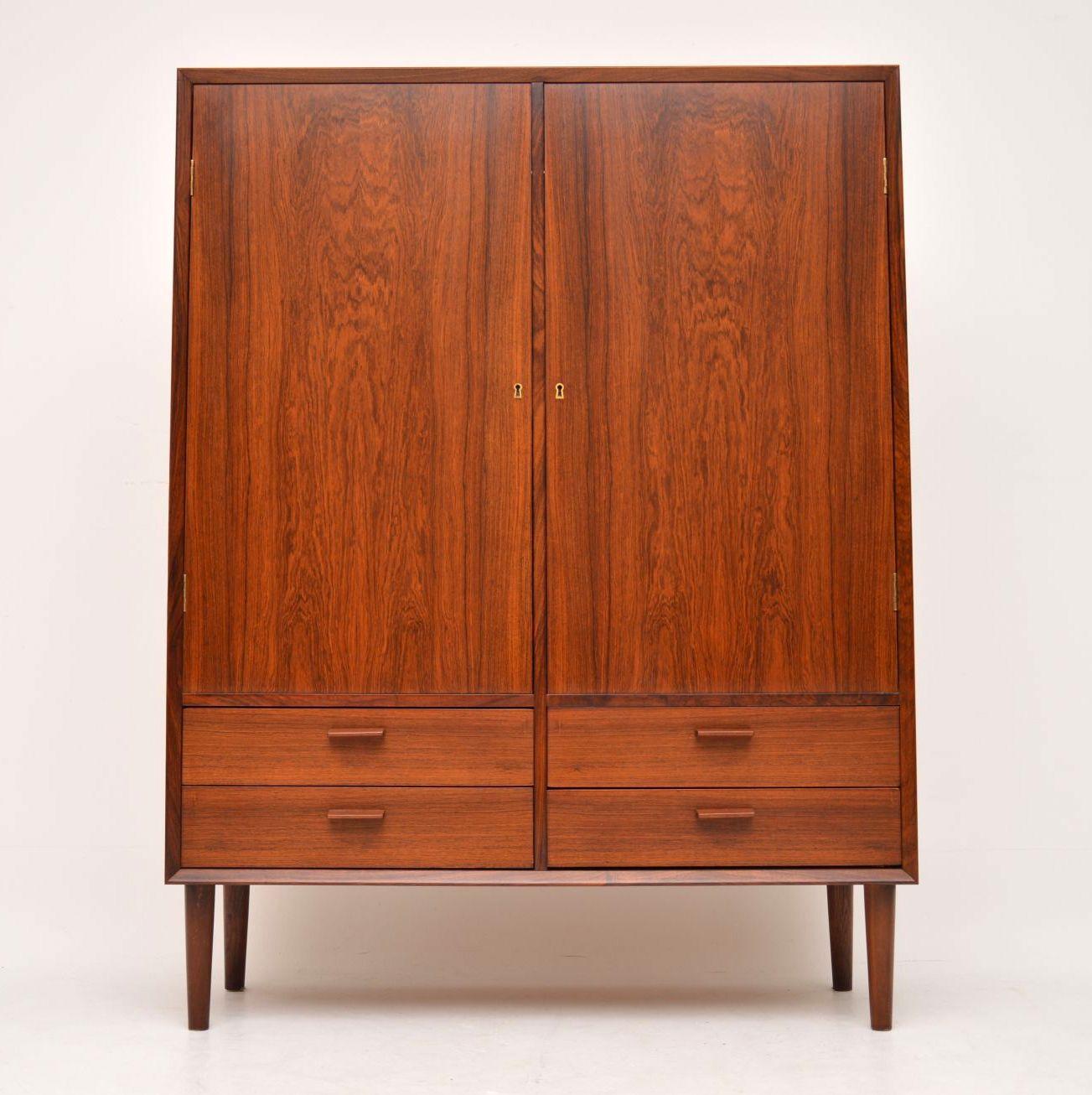 A stunning and rare vintage Danish cabinet, this was designed by Borge Mogensen, and it was made by Brouer in the 1960s. We have had this stripped and re-polished to a very high standard, including the inside; the condition is superb throughout. The