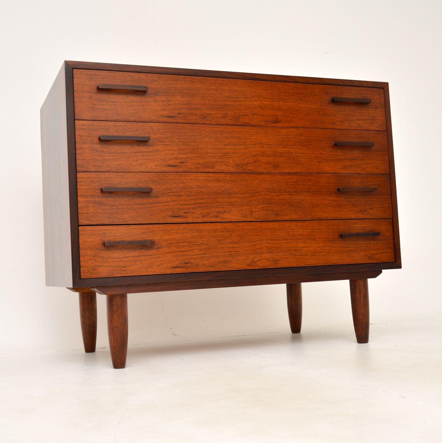 A gorgeous vintage Danish chest of drawers. This was designed by Kai Kristiansen, it was made in Denmark in the 1960’s.

It is of superb quality, with a very stylish and practical design. The colour and wood grain patterns are beautiful, this