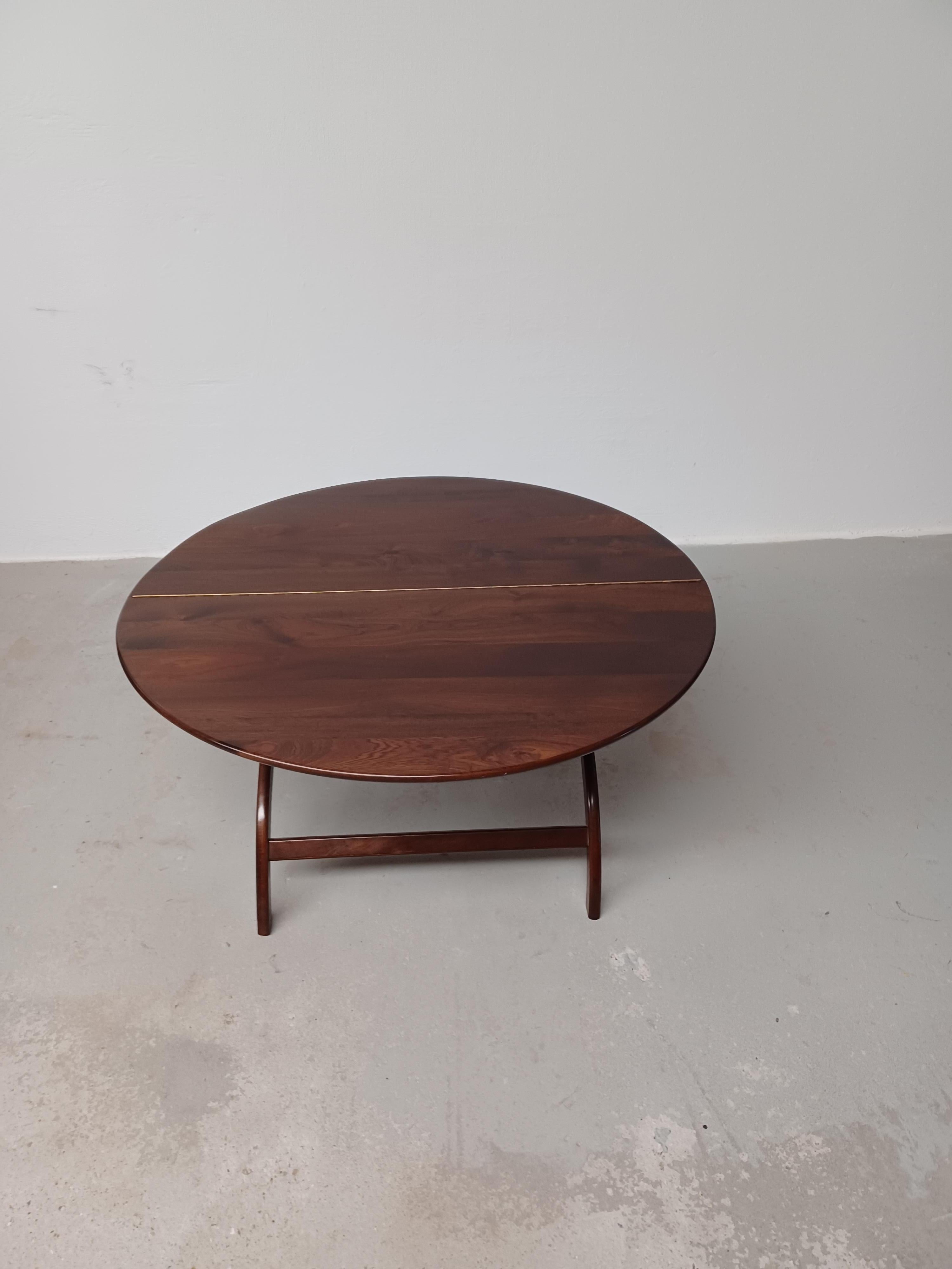 1960s Danish Circular Handcrafted  Foldable Mahogany Coffee Table

The rare well designed and very well crafted foldable coffee table in solid mahogany was ordered by the former owners mother at a master cabinetmaker back in the 1960's and has been