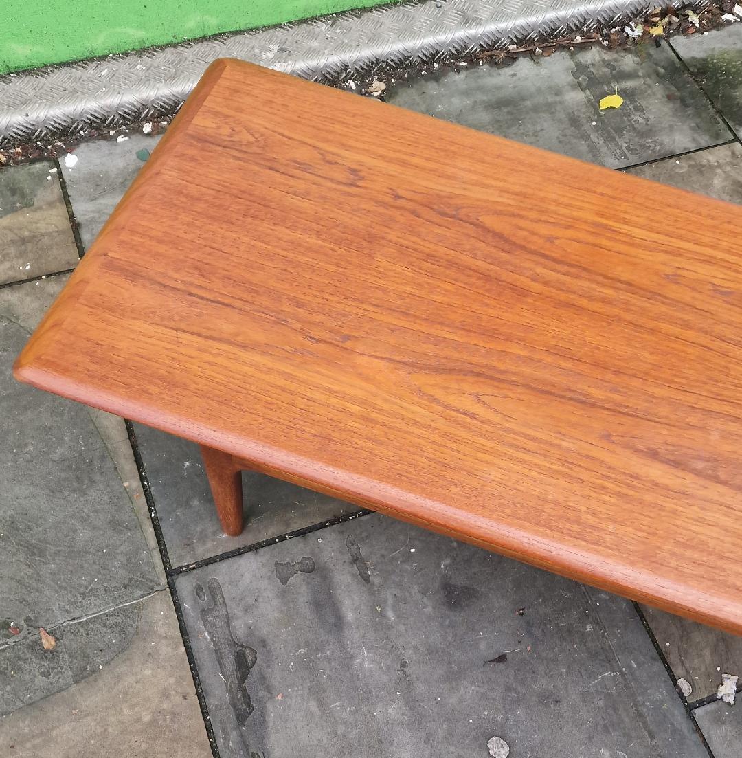 Classic designed Danish table
by Trioh with original lower cane shelf
Cc1960