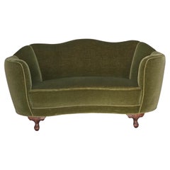 1960s, Danish curved 2-seater sofa, green furniture velour, oak wood legs.