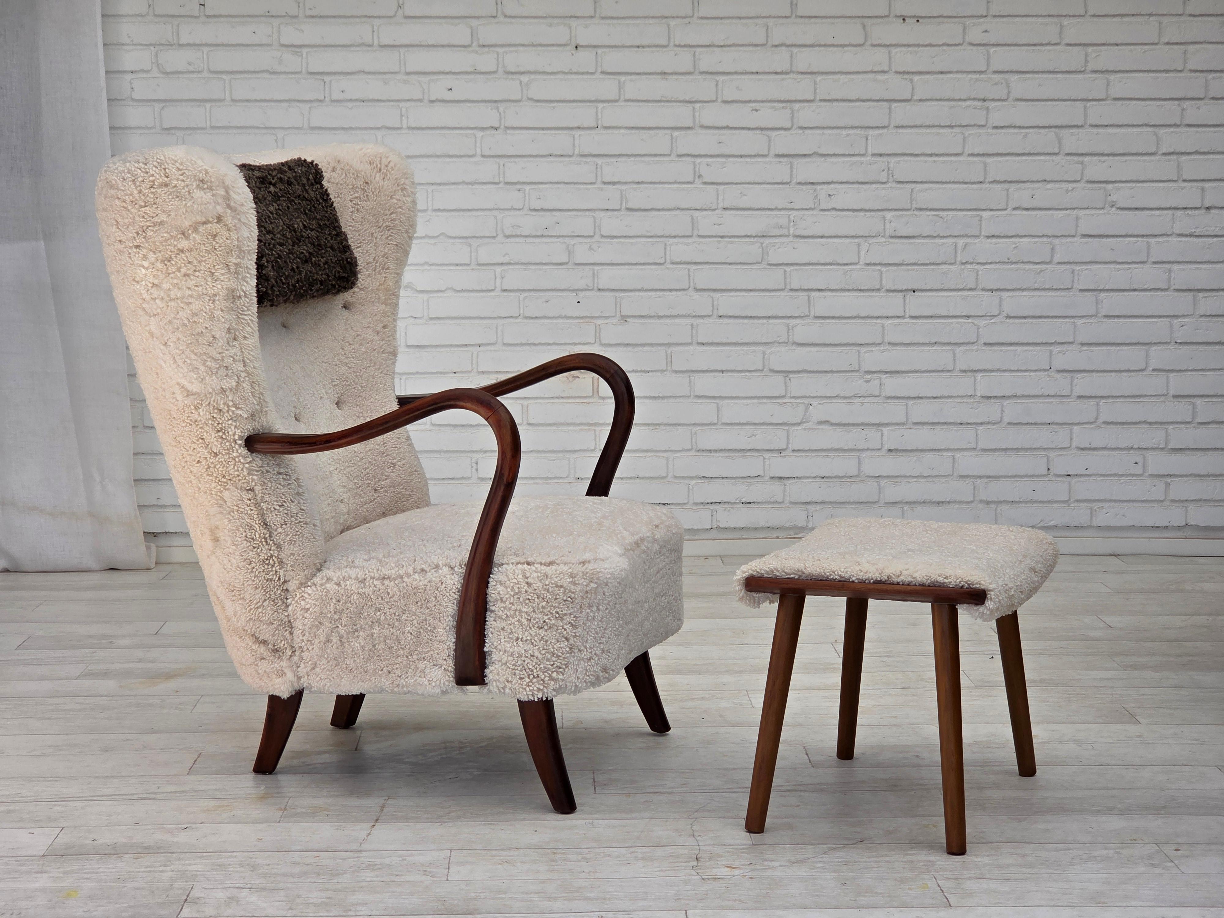 1960s, Danish design by Alfred Christensen for Slagelse Møbelværk. Completely renovated armchair with stool. Reupholstered in top quality New Zealand sheepskin “Canberra“. Brand new neck cushion in quality brown New Zealand sheepskin 