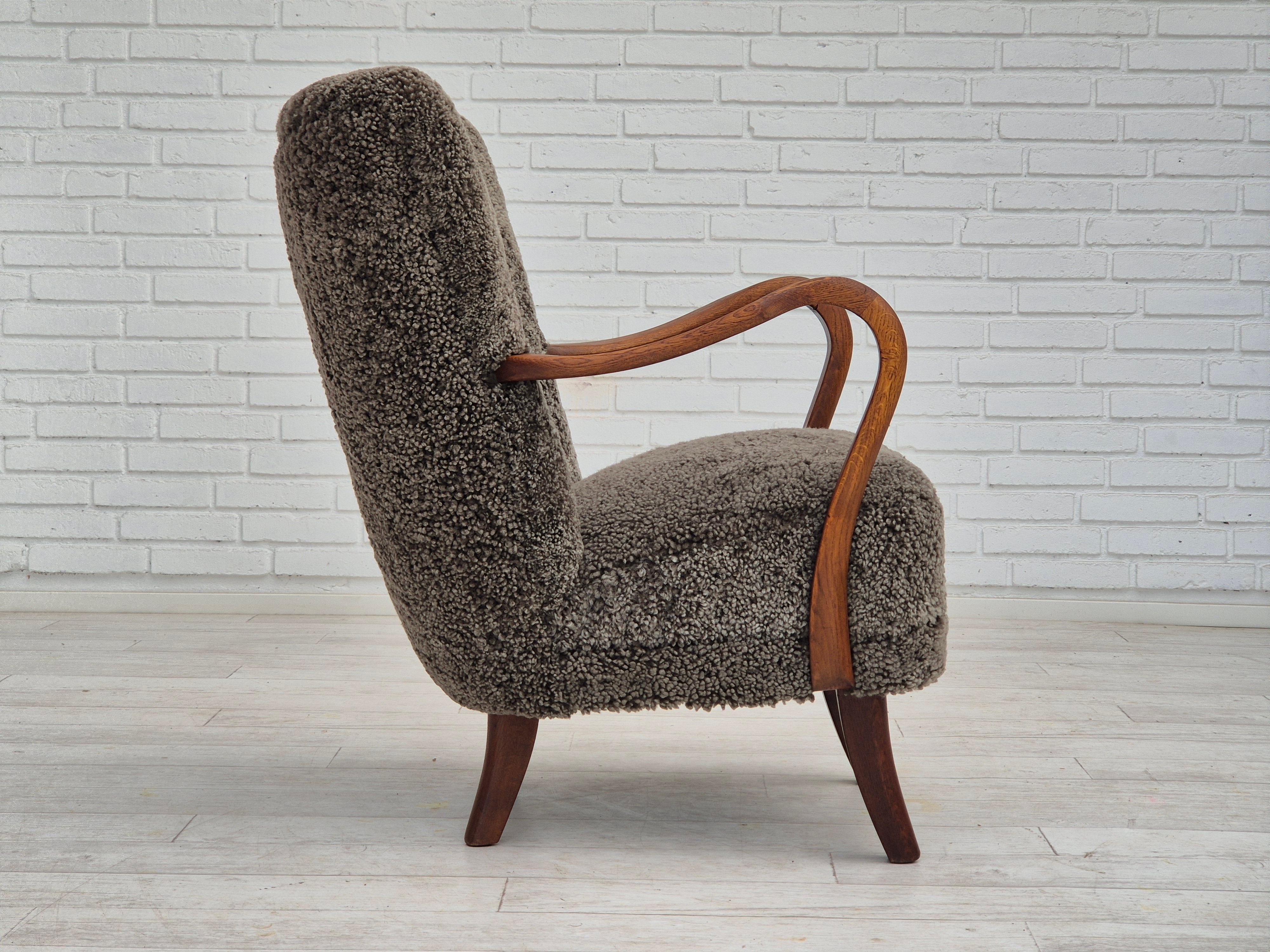 Mid-20th Century 1960s, Danish design by Alfred Christensen, refupholstered armchair, sheepskin.