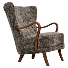 Vintage 1960s, Danish design by Hjørring Møbel, reupholstered armchair, sheepskin.