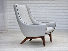 Anni '60, design danese di Illum Wikkelsø, modello ML 140 con sgabello, tappezzato.
