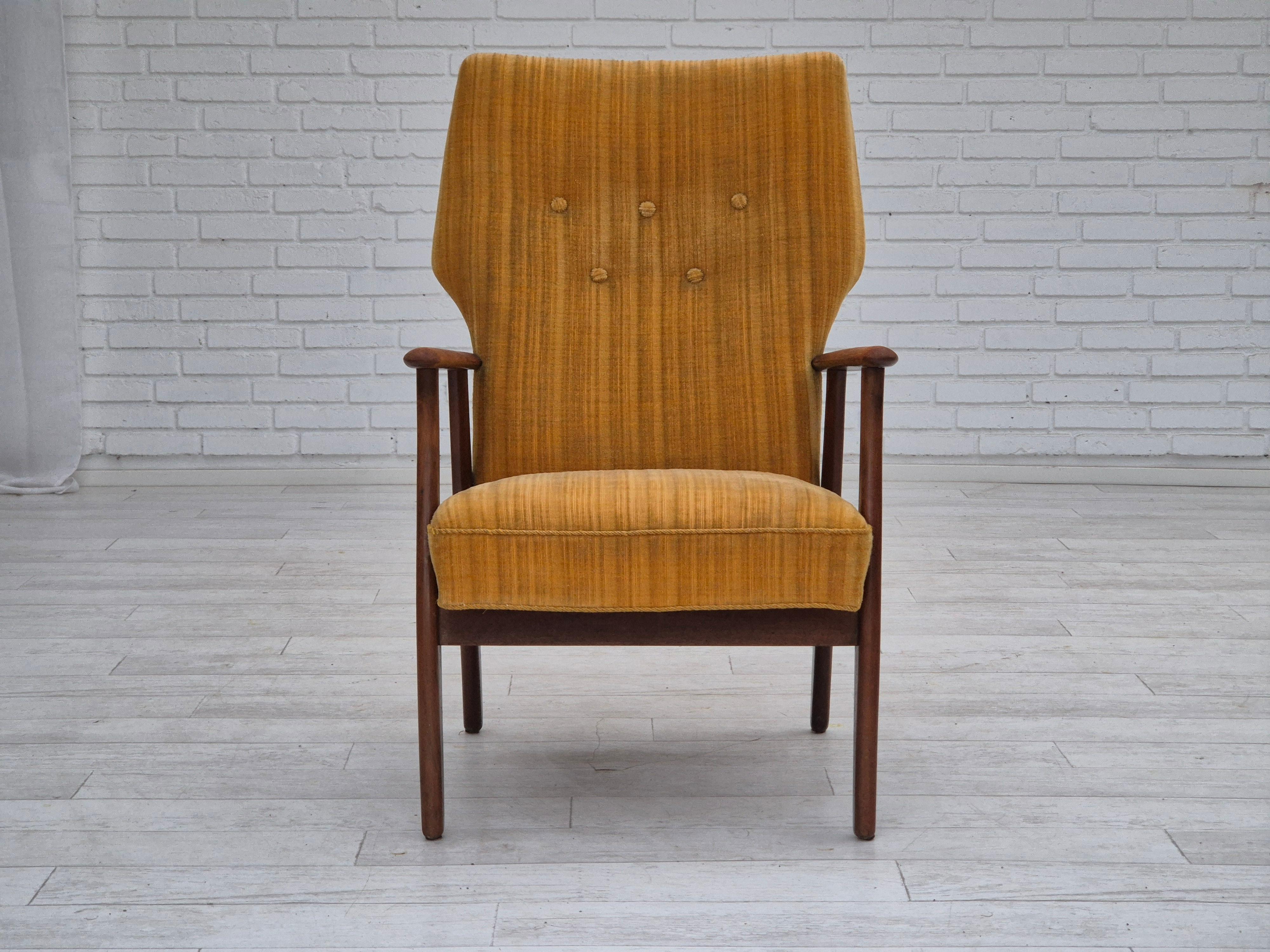1960s, Danish design by Kurt Olsen for Slagelse Møbelværk. Armchair model 230 in original good condition: no smells, no stains, and stable construction. Original yellow furniture velour fabric, renewed beech wood. Manufactured by Danish furniture