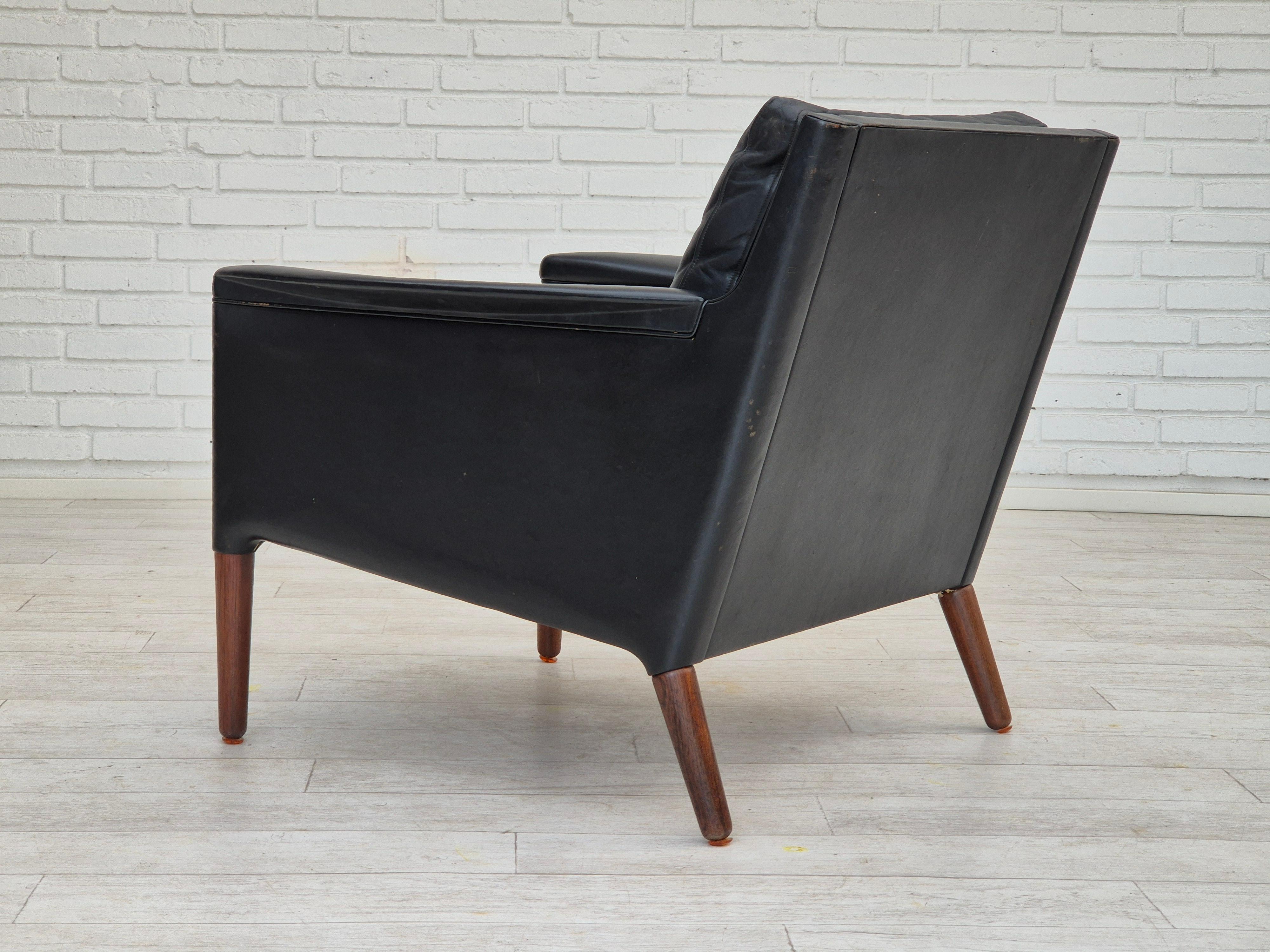 1960s, Danish design by Kurt Østervig, lounge chair model 55, leather, rosewood. For Sale 1