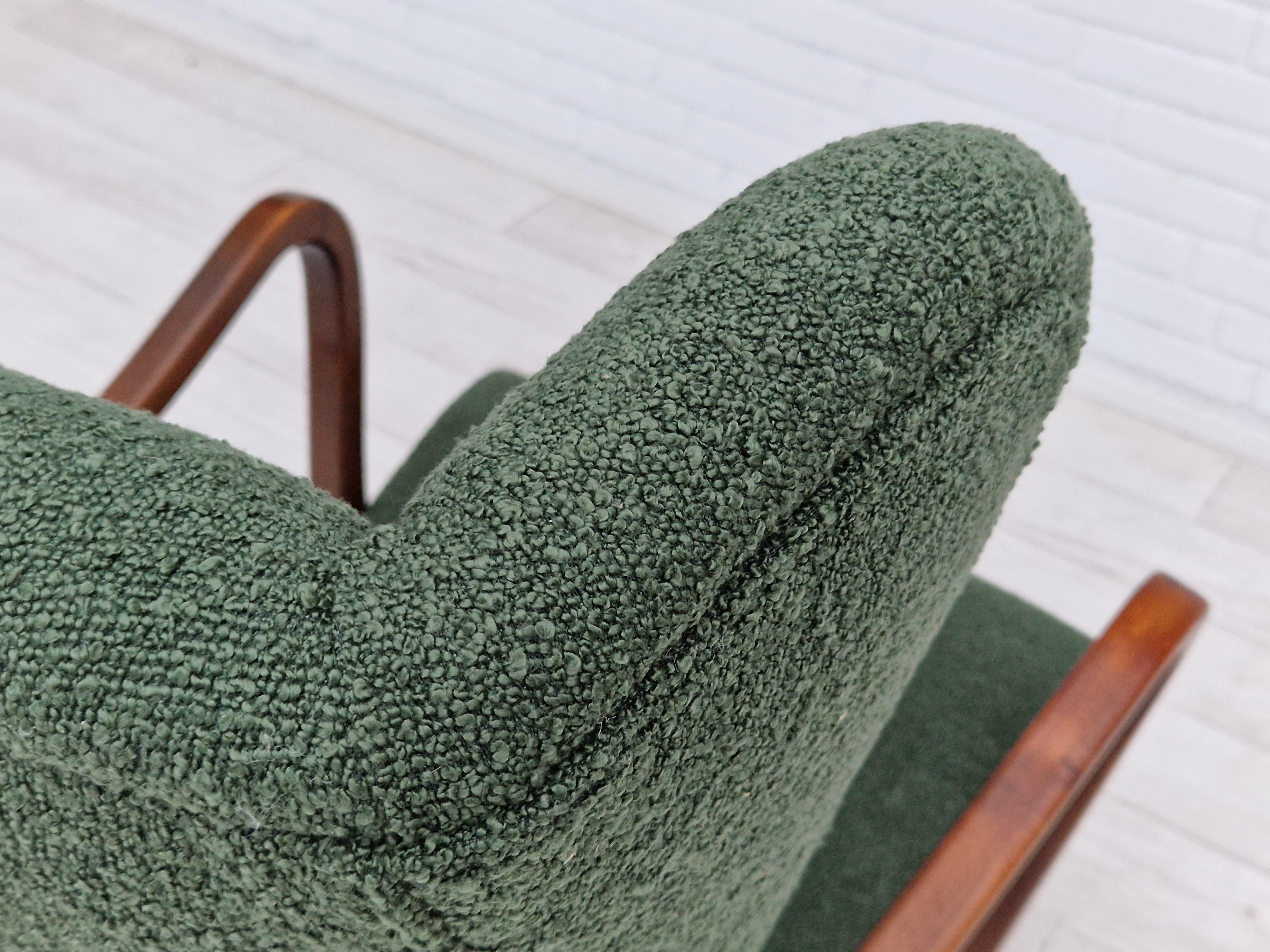60s, Danish designed high-backed completely refurbished-reupholstered armchair. Brand new upholstery. Quality bottle green upholstery fabric. Green buttons in artificial leather. Beech wood legs and armrests. Manufactured by Danish furniture