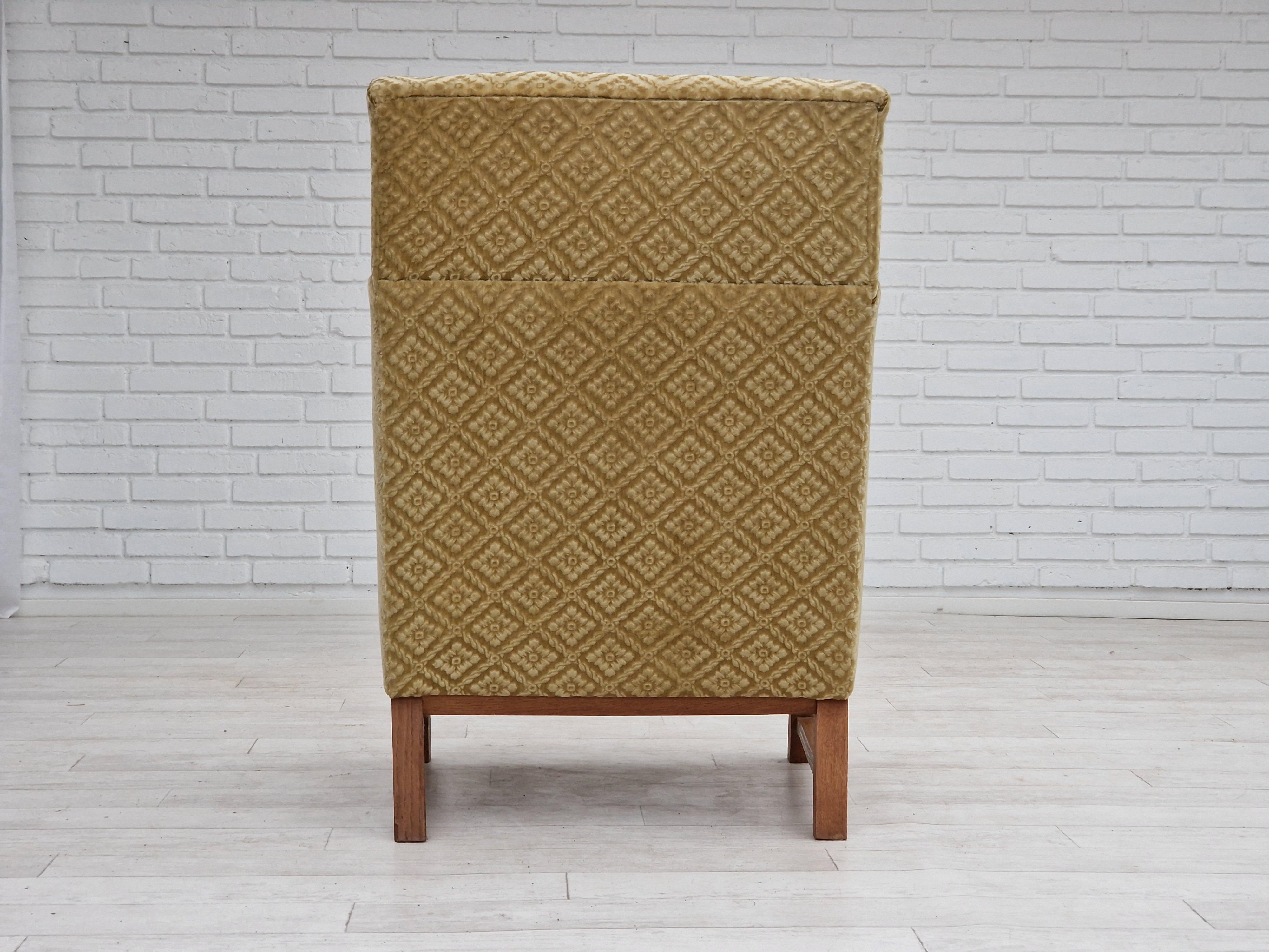 Mid-20th Century 1960s, Danish design, highback armchair, furniture fabric, oak wood. For Sale