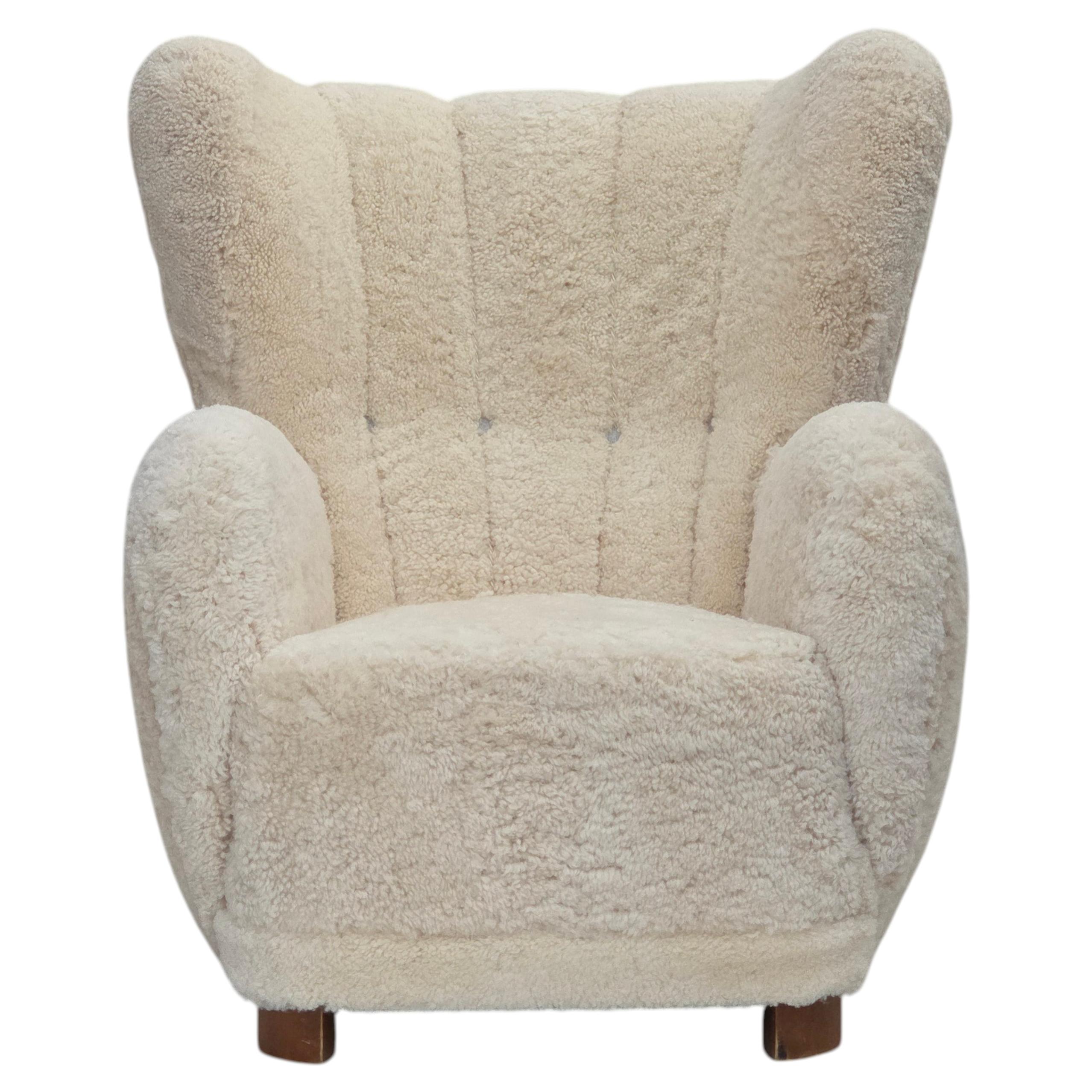 1960s, Danish design, reupholstered highback armchair, genuine sheepskin.