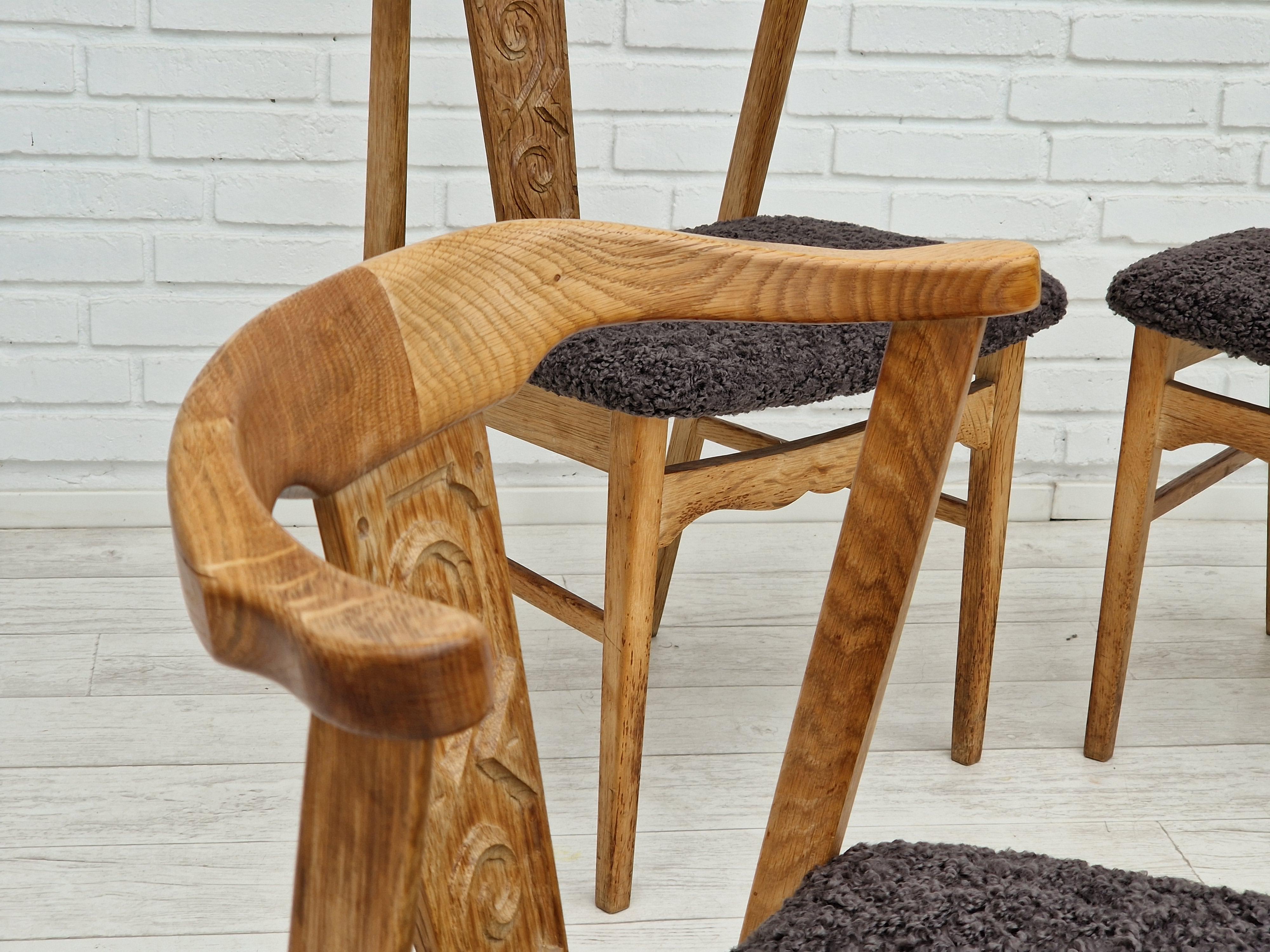 Original Danish design by Henning Kjærnulf from about 1960s. Set of 4 dinning chairs, oak wood, quality grey sheepskin imitation. Reupholstered by professional upholsterer, craftsman. Made by a Danish furniture manufacturer. Wood has no defects and
