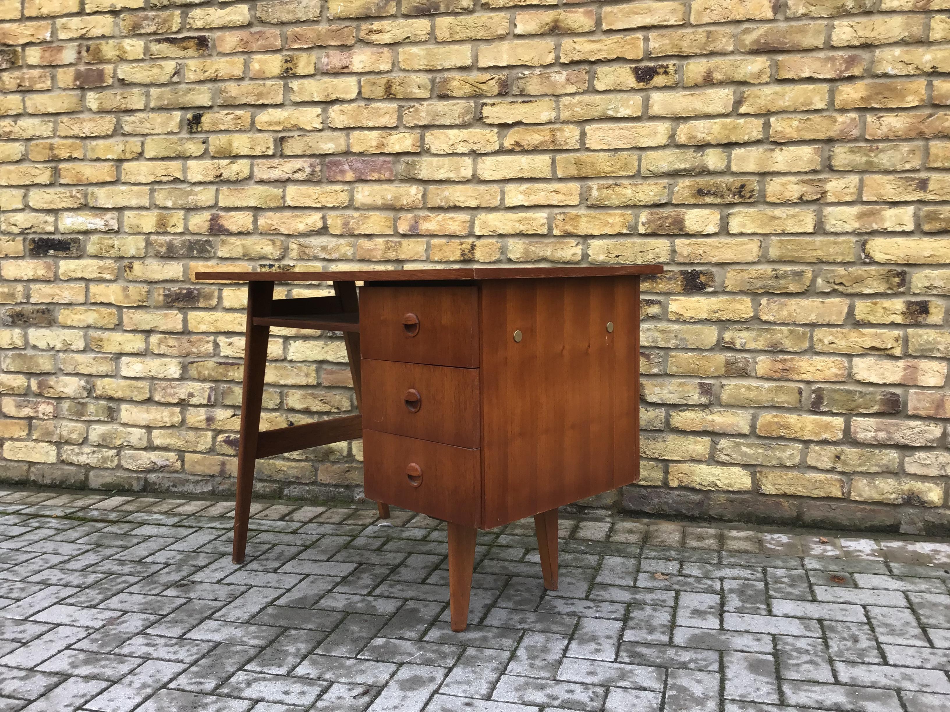 Small compact teak desk with 3 storage draws 

circa 1960s Danish.