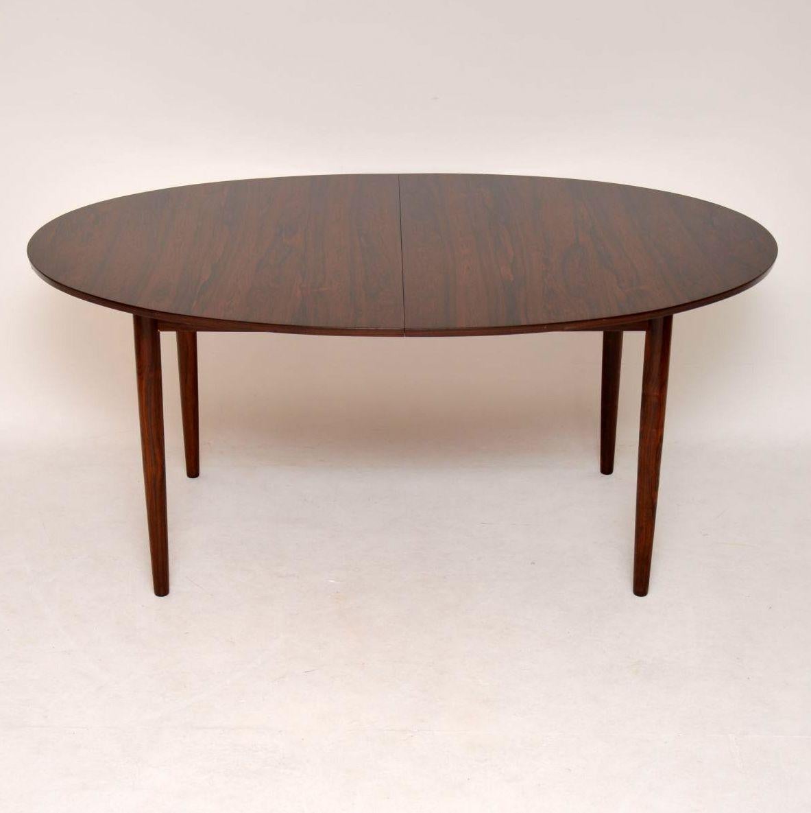 An extremely rare and beautifully made Danish dining table, designed by one of the great pioneers of Danish modern design, Finn Juhl. This was made in Denmark in the 1960s by the master cabinet maker Niels Vodder. It was bought from new by the
