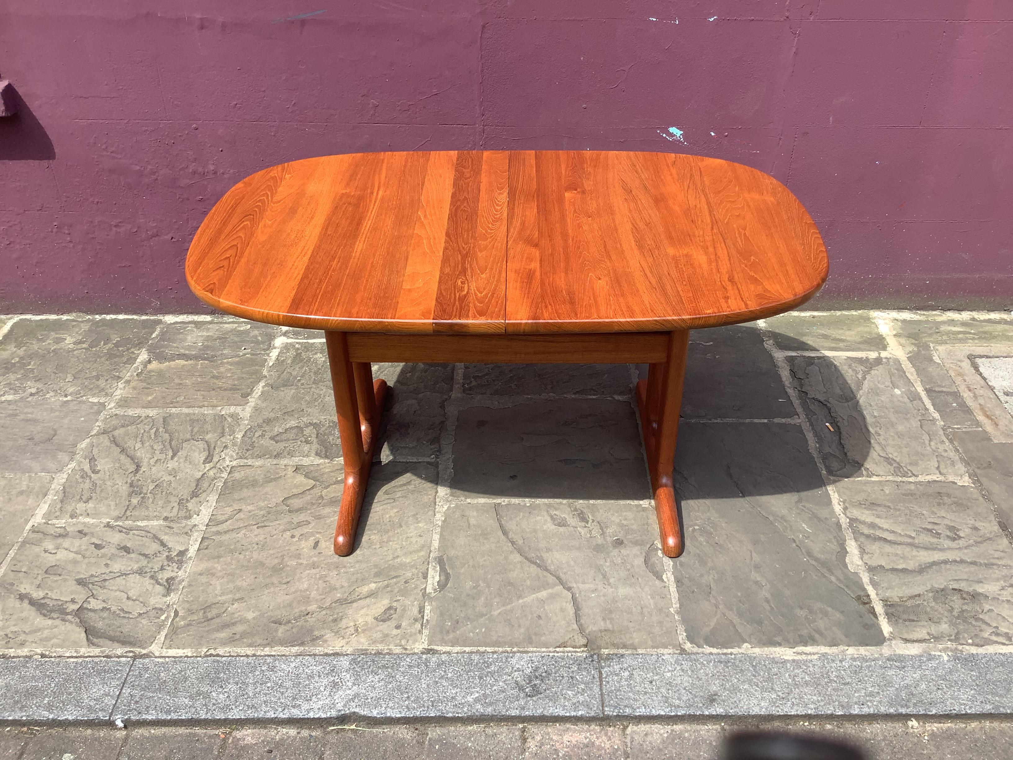 Vintage Danish extendable dining table table solid teak Glostrup
 
 Danish oval extendable dining table made of solid teak from the 1960s by the Danish brand Glostrup. The table is labeled on the underside.
 
 The table is made of solid teak wood,