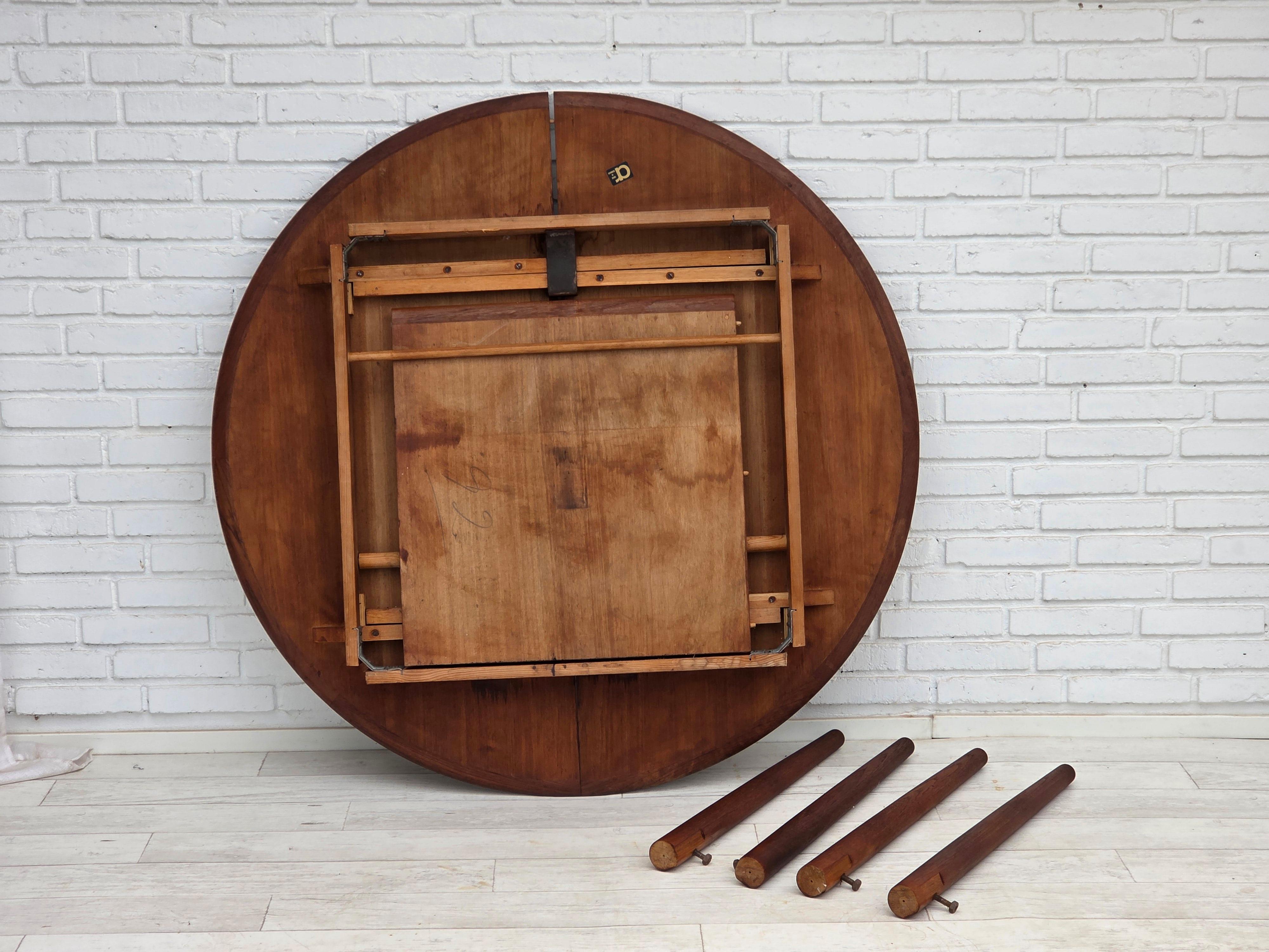 1960s, Danish round foldable dining teakwood table. Original good condition: no smells, no stains and stable construction. Teak wood. Manufactured by Danish furniture maker in about 1960-65s. Original Scandinavian vintage design directly from