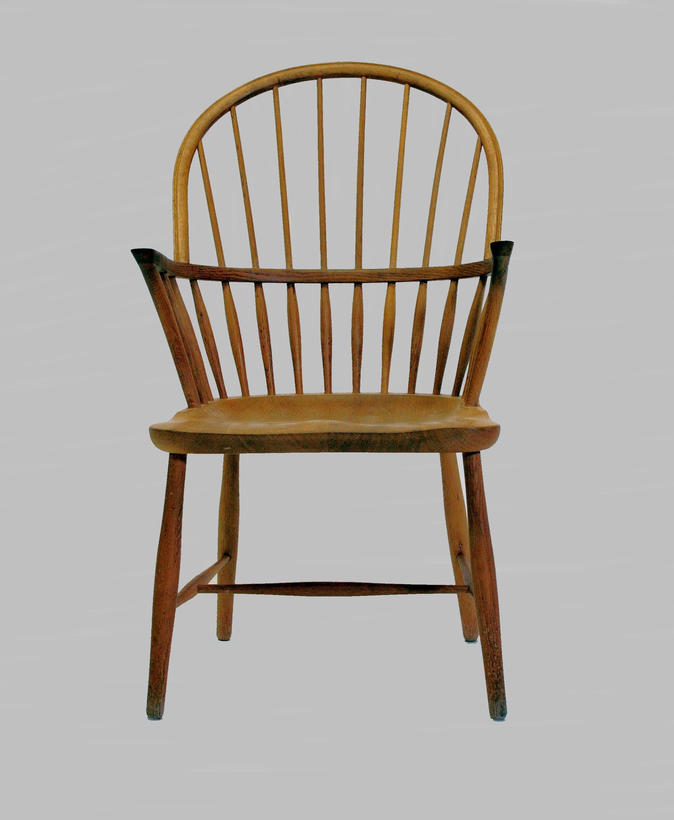 CH 18A high back windsor chair in oak designed by Frits Henningsen and made by Carl Hansen & Søn. 

The chair features very skilled craftmanship by the cabinetmakers with a semicircular back supported by upright rods, the CH1 8A is clearly