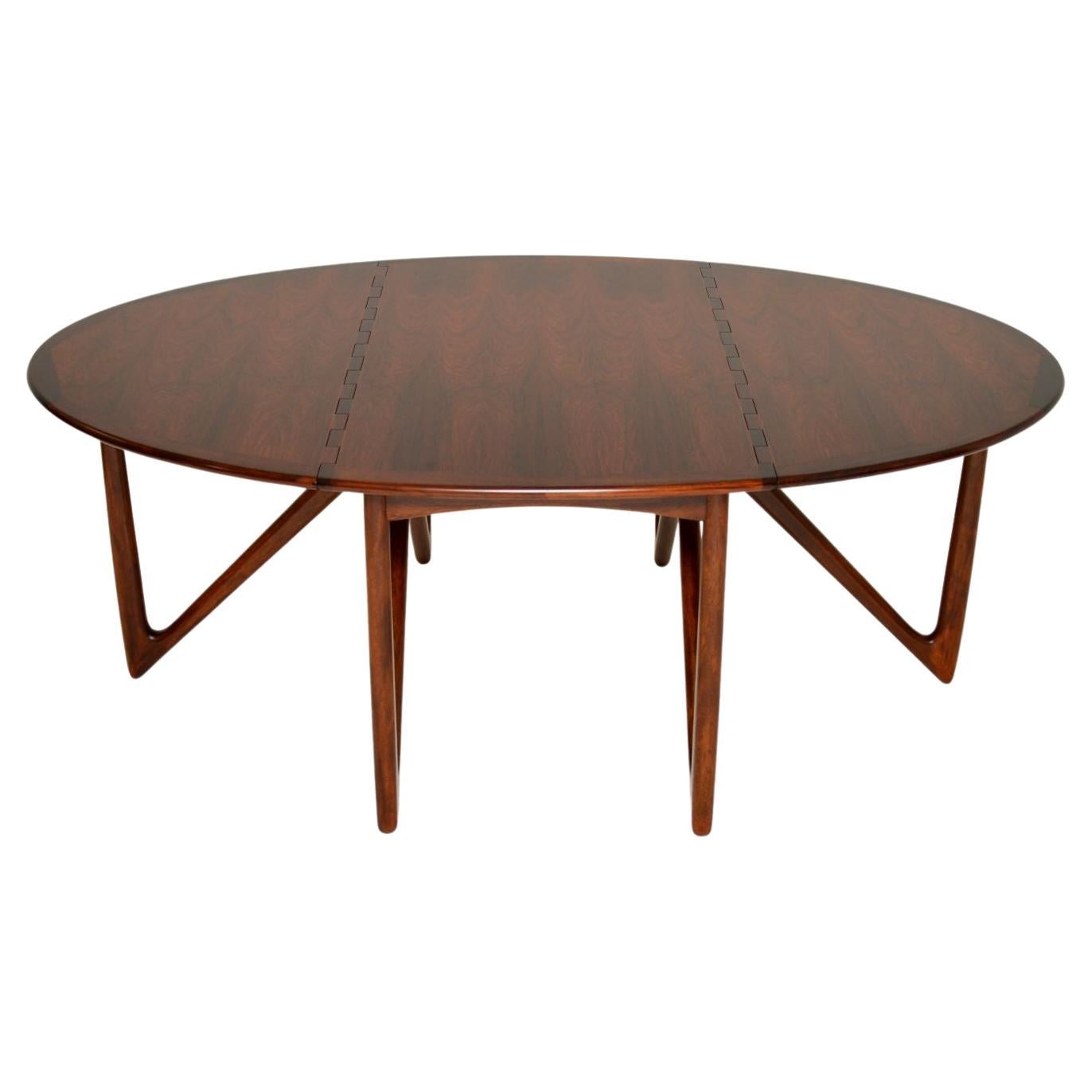 An absolutely magnificent Danish drop leaf dining table. This iconic design is by Niels Koefoed, made by Koefoeds Horslet in the 1960’s.

The quality is outstanding, the way the joints of the drop leaf top interlock is really thing of beauty. It is