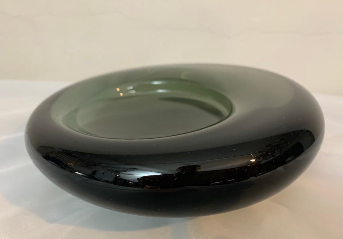 1960s smoky heavy grey handmade glass decorative bowl or dish . Manufactured by Holmegaard in Denmark. Designed by Per Lütken.  The pattern number is 16039 which is etched and also signed on the base.

Beautifully formed with the bowl element being