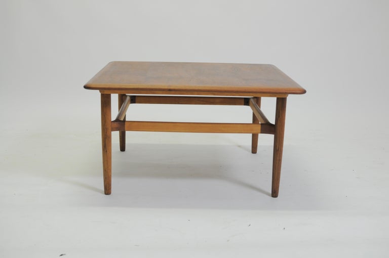 Danish Kurt Østervig 1960s coffee table by Jason Møbler.

Very well crafted coffee table with tabletop in teak, legs in oak and beams in beech that mingle into each other as evidence of Good Design and the supreme craftmanship that often
