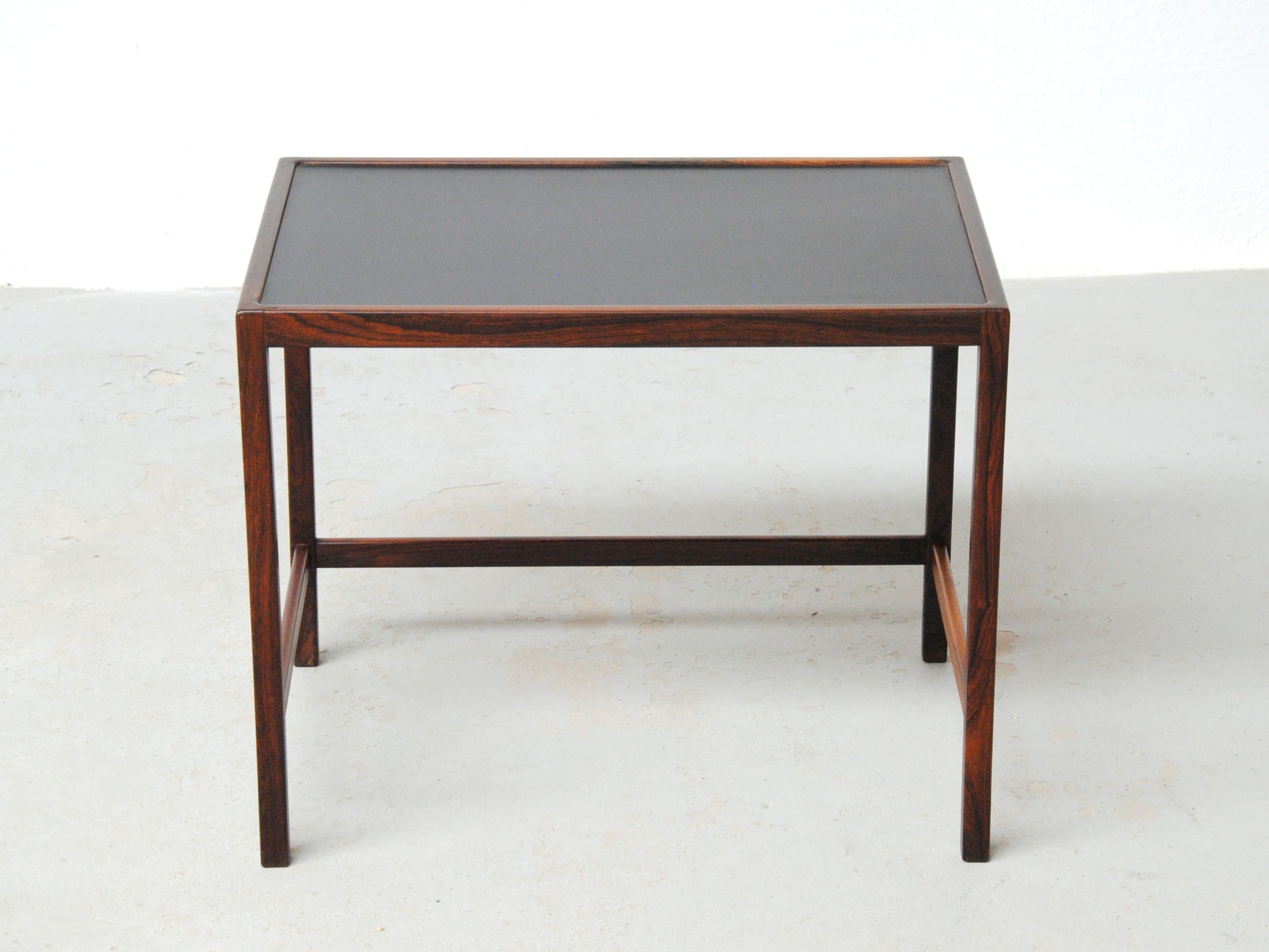 Danish Kurt Østervig 1960s side table by Jason Møbler.

Very well crafted small sidetable table with tabletop in black formica and frame in rosewood. 

The side table has been fully restored and refinished by our cabinetmaker to ensure that it´s