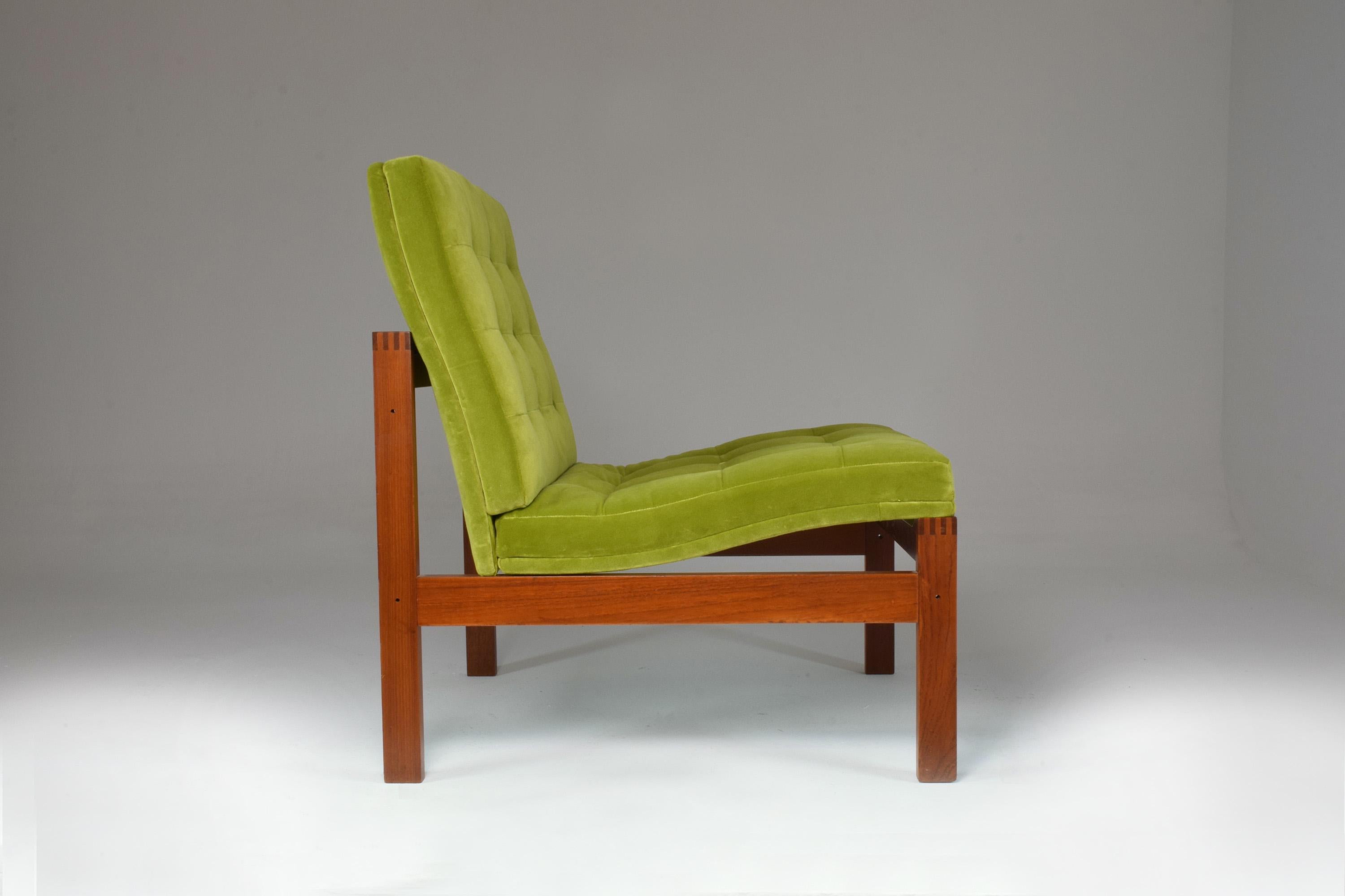 A Mid-Century Modern Danish collectible cool low lounge chair designed Ole Gjerløv-Knudsen for France & Søn. The sleek teak frame and upholstery are impeccably restored by our atelier in a beautiful lime green velvet with new foam padding. 



We