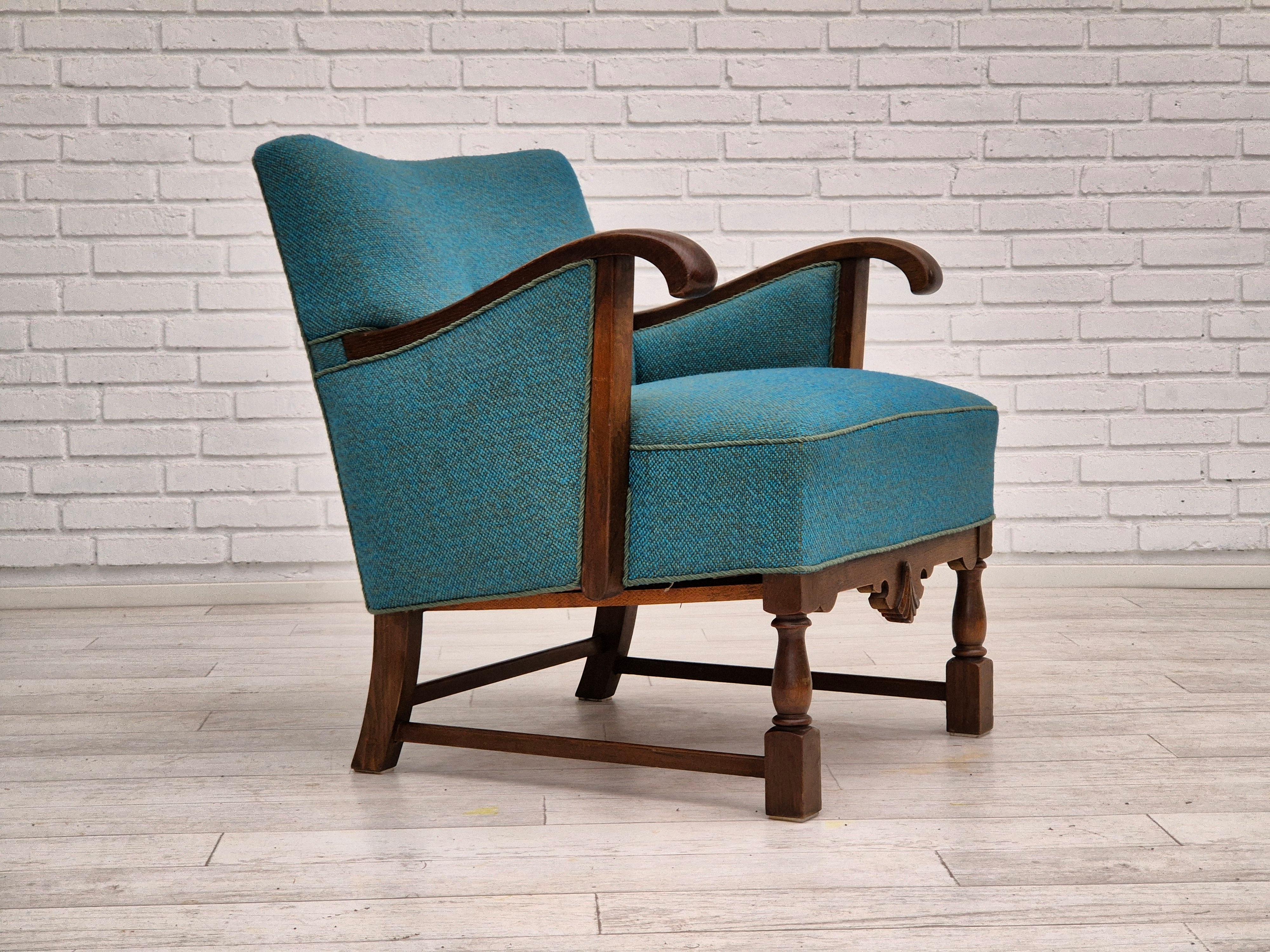 1960s, Danish lounge chair in very good condition: no smells and no stains. Chair was reupholstered about 20 years ago by craftsman. Furniture wool, oak wood, springs in the seat. Manufactured by Danish furniture manufacturer in about 1955-60s.