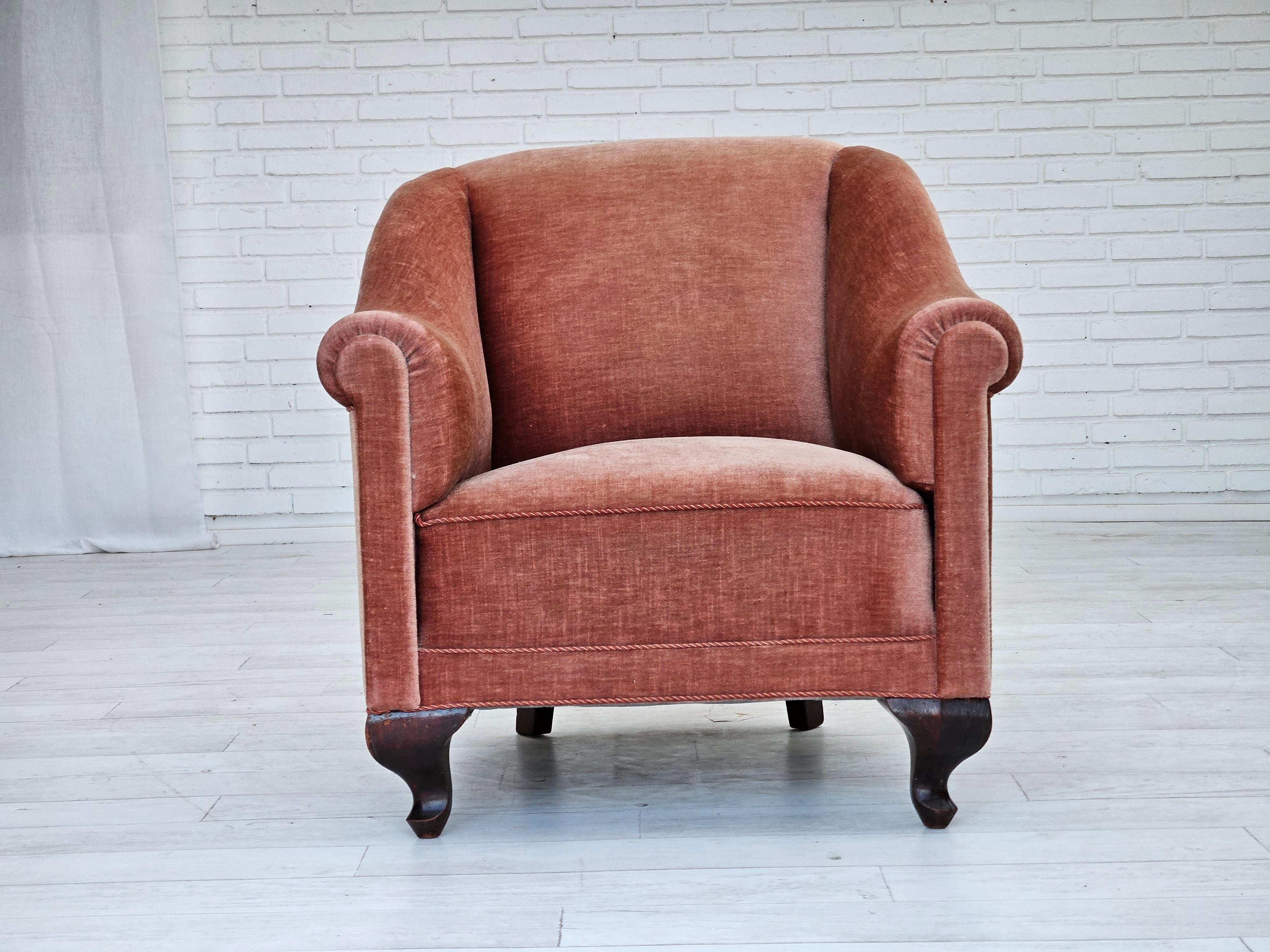 1960s, Danish lounge chair. Salmon pink furniture velour, brass springs in the seat, ash wood legs. Very good condition: no smells, no stains, and stable construction. New belts under the seat. Manufactured by Danish furniture maker in about
