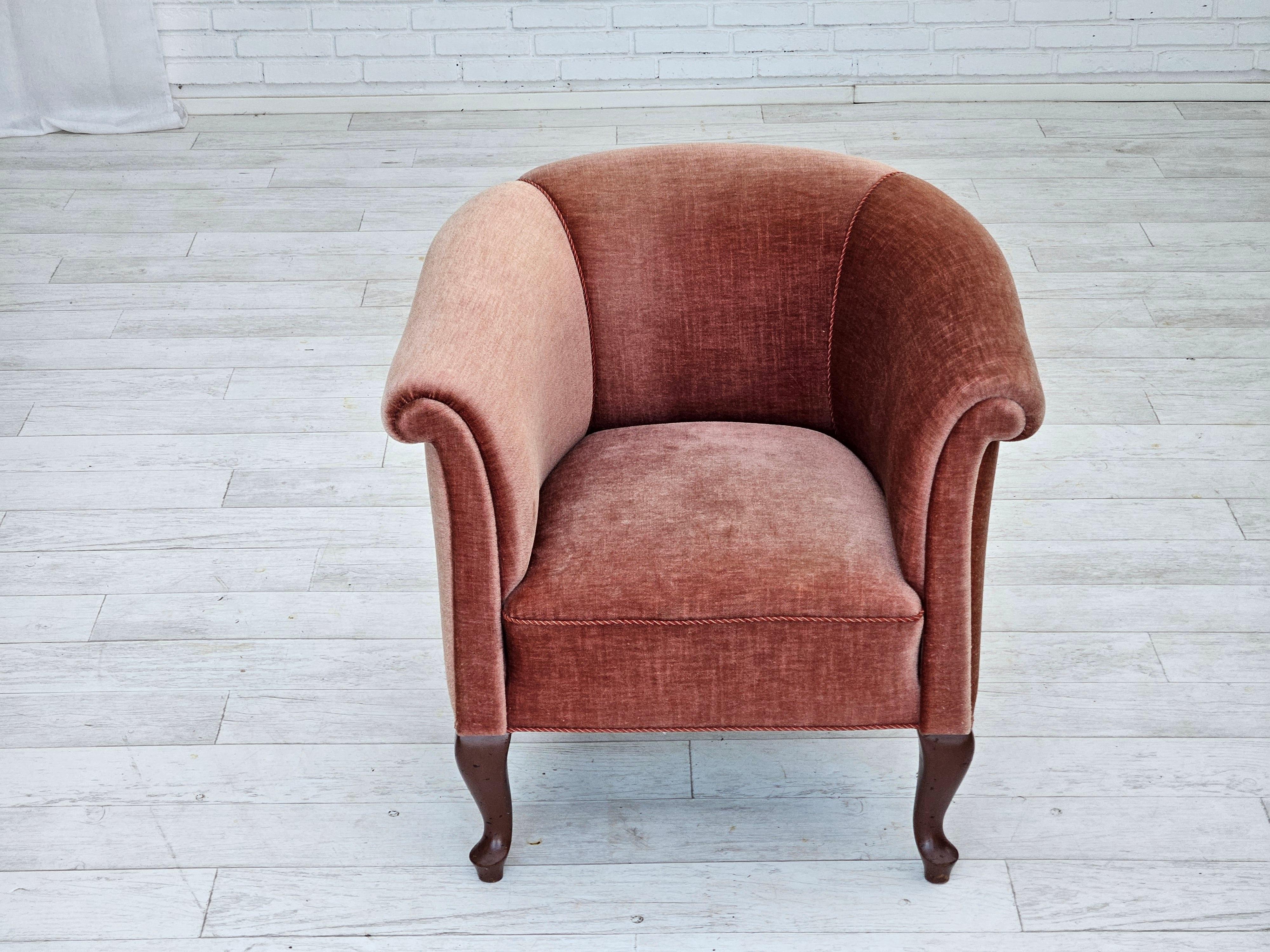 1960s, Danish lounge chair. Salmon pink furniture velour, brass springs in the seat, ash wood legs. Very good condition: no smells, no stains, and stable construction. New belts under the seat. Manufactured by Danish furniture maker in about