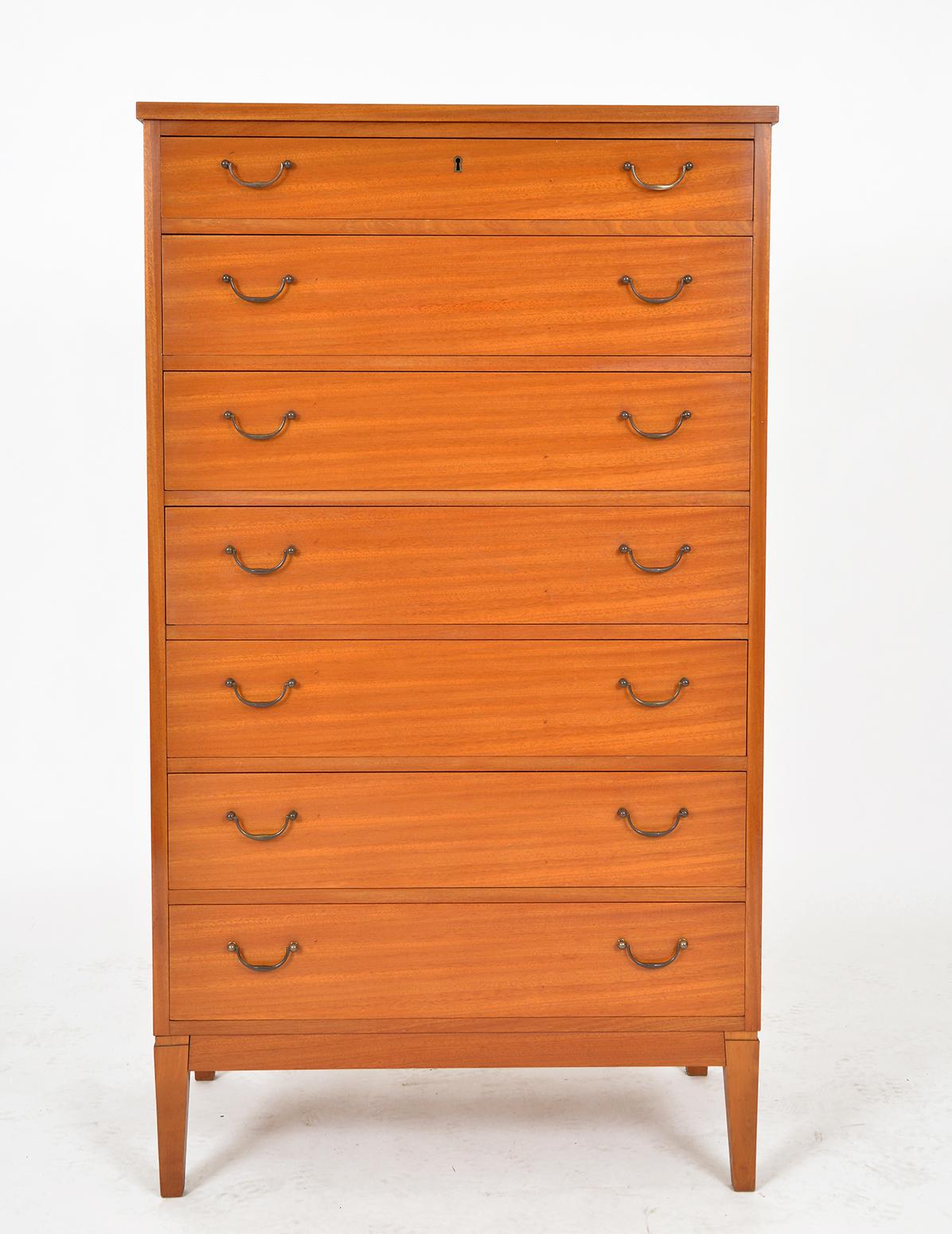 This wonderful tall boy chest of drawers dating from the 1960s was produced by Søborg Møbelfabrik, Copenhagen. They collaborated with several important cabinetmakers, architects, and burgeoning designer talents over the Mid-century period such as