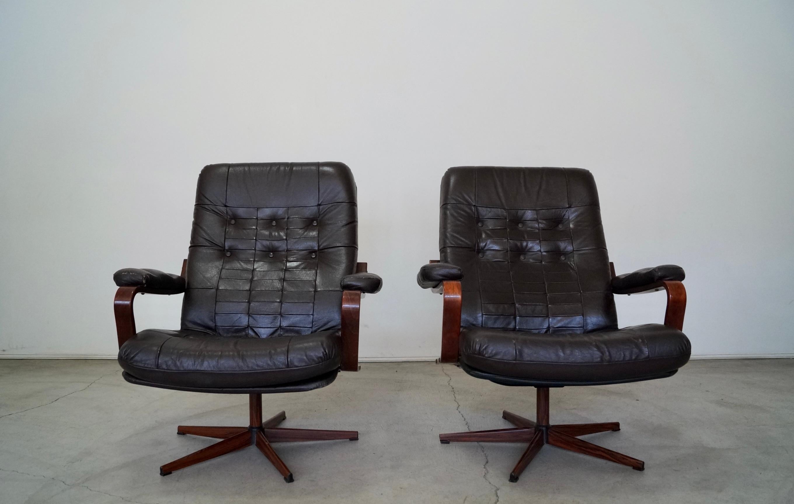 Pair of Mid-Century Modern lounge chairs for sale. From Scandinavia, and in the manner of Westnofa. Manufactured by Kropp/Stolen in the 60's in Sweden, and imported by Finmark. It has a metal star base with a rosewood finish, and a metal pole that