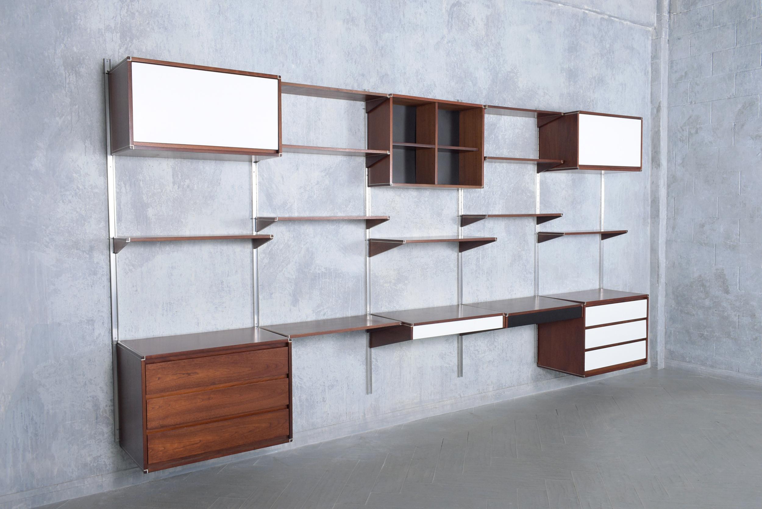 Step into the world of mid-century modern design with our circa 1960s Danish modern bookshelf meticulously handcrafted from mahogany and in superb condition. This piece has been completely restored and refinished by our team of expert craftsmen,