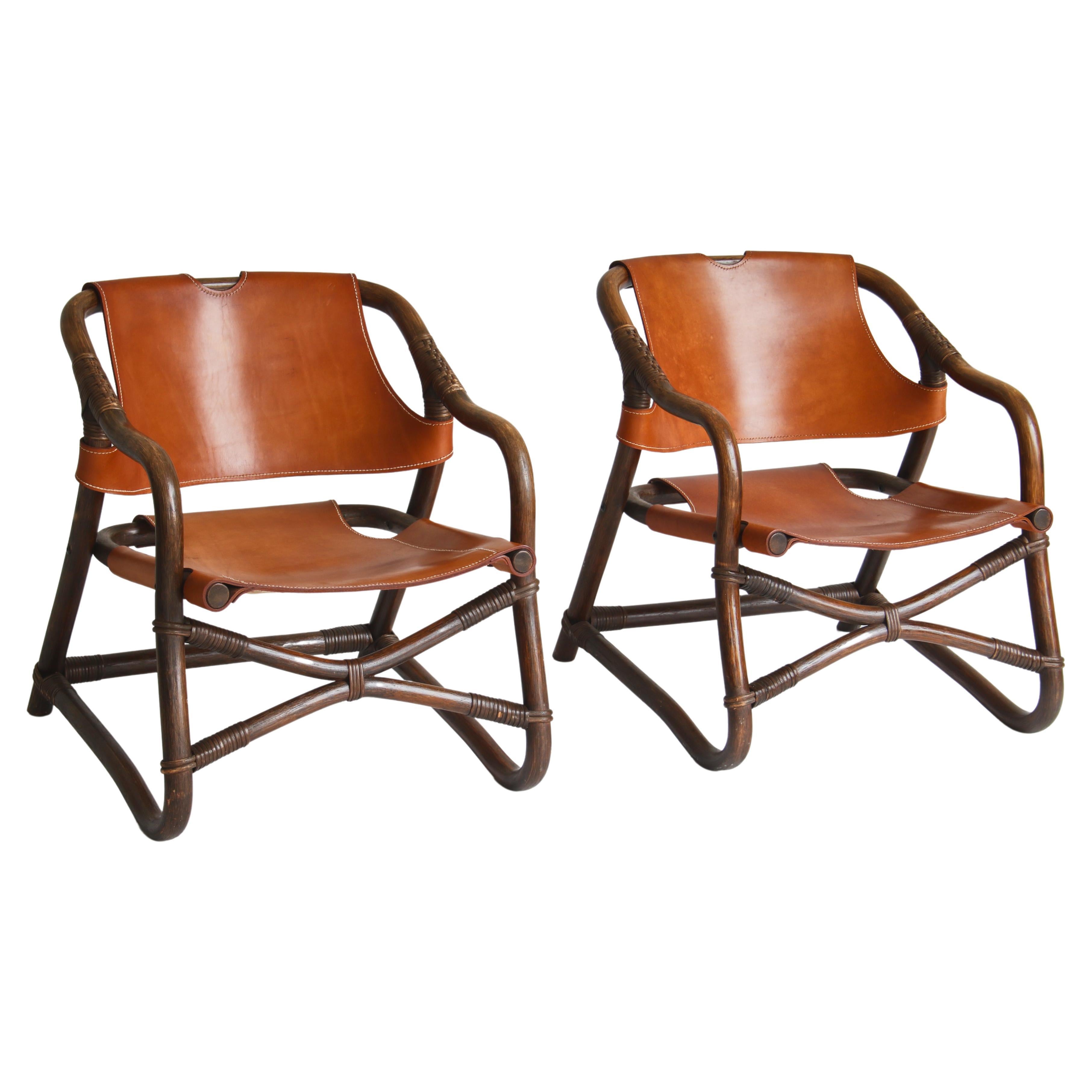 1960s Danish Modern "Manilla" Lounge Chairs in Stained Bamboo and Saddle Leather