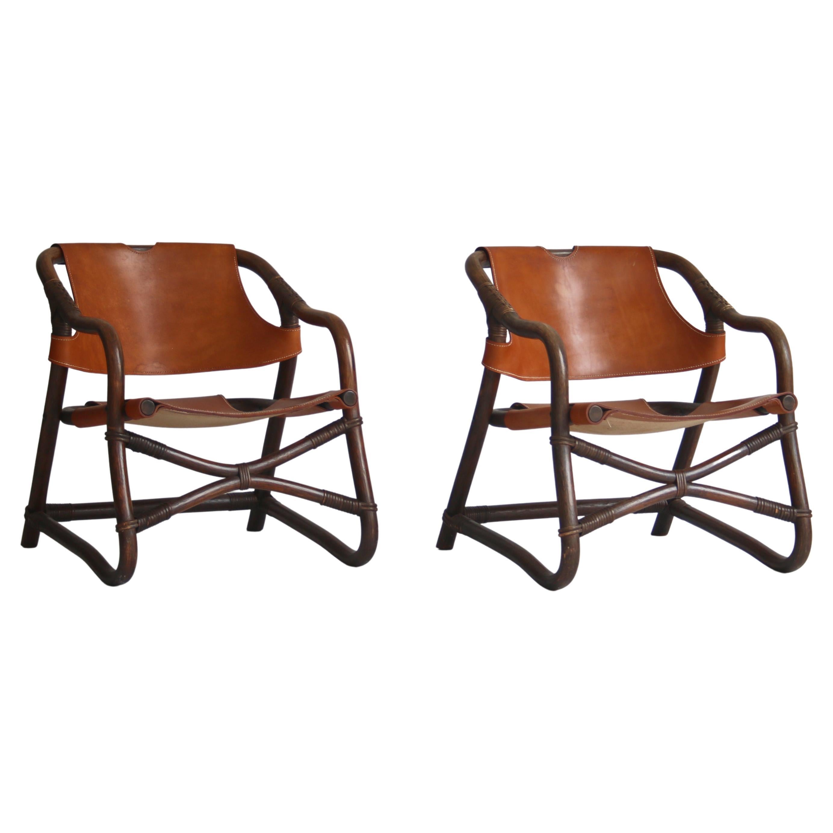 1960s Danish Modern "Manilla" Lounge Chairs in Stained Bamboo and Saddle Leather