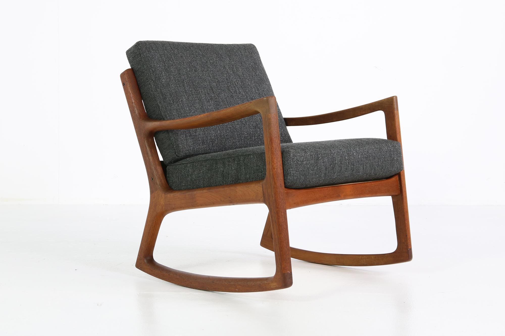 Beautiful midcentury danish modern Rocking Chair, produced by France and Son, designed by Ole Wanscher, made in Denmark. Solid teak wood, includes maker's stamp and badge. The cushions reupholstered and newly covered with woven fabric. Great vintage